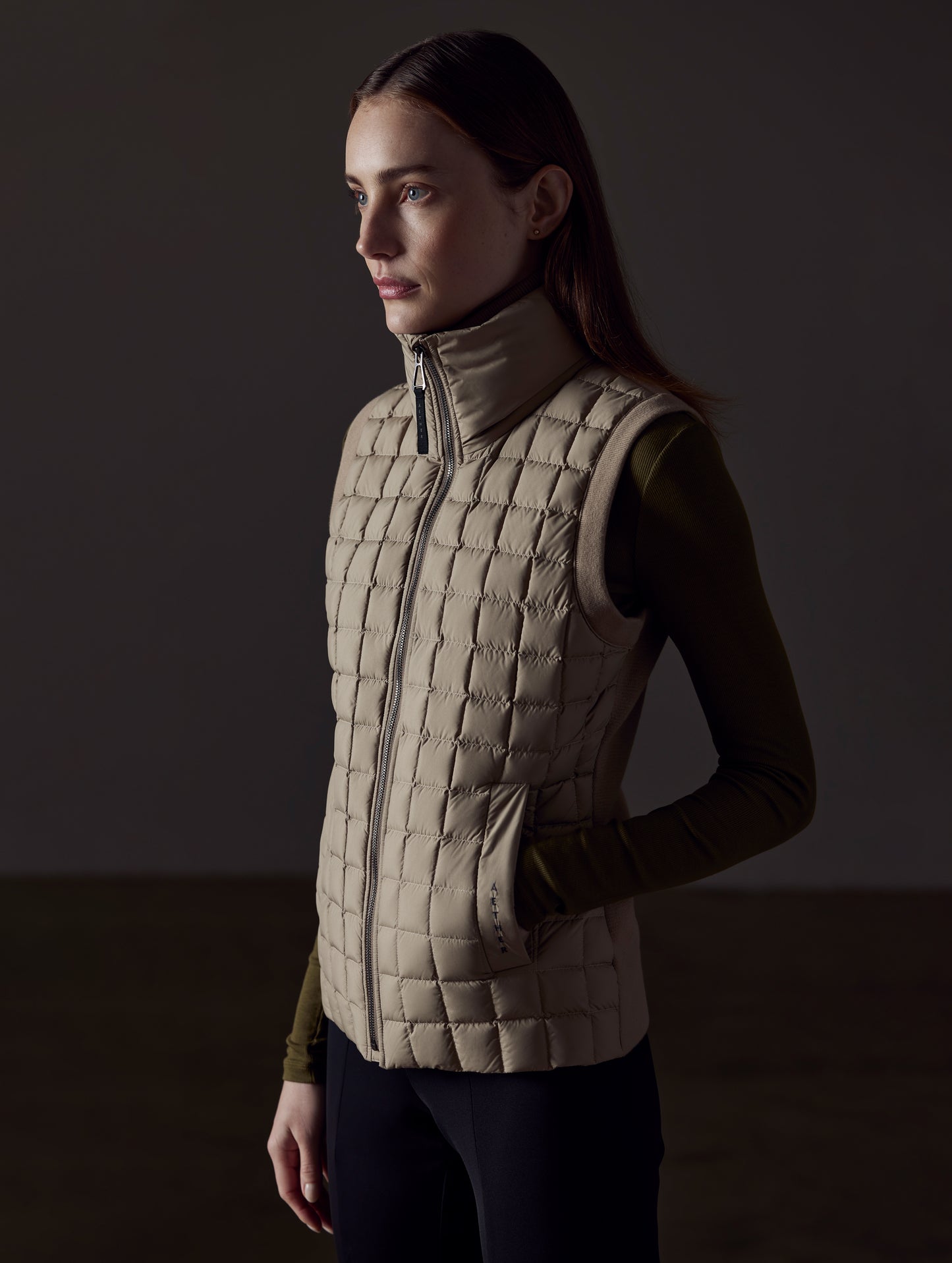 woman wearing brown vest from AETHER Apparel