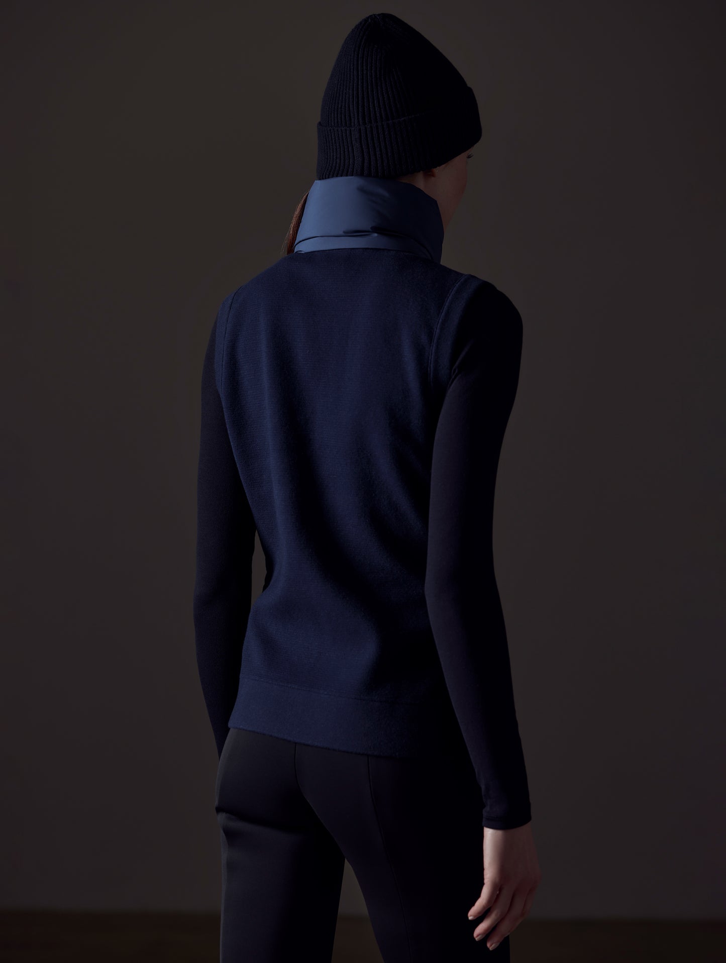 woman wearing blue insulated vest from AETHER Apparel