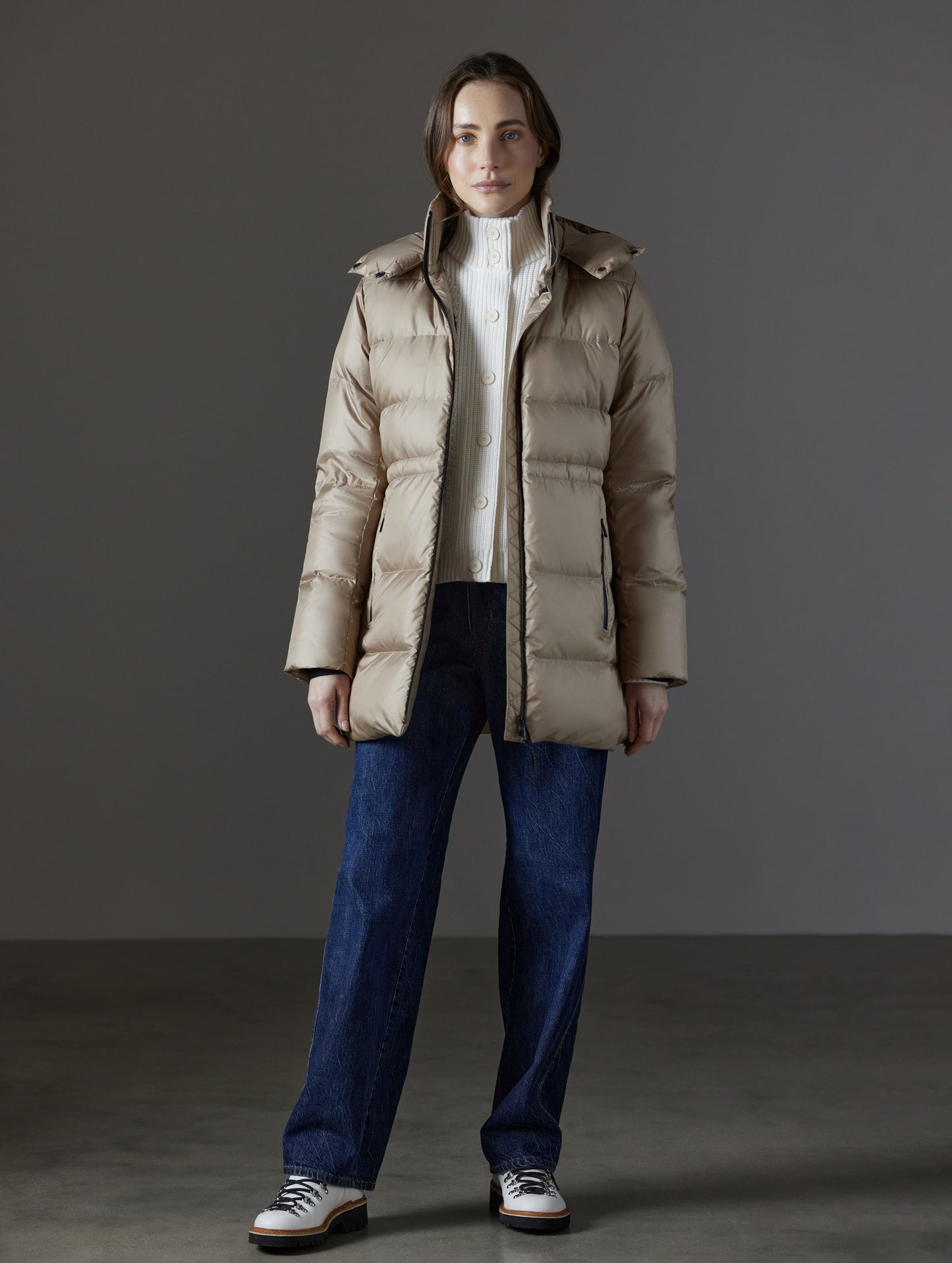 Front full-body view of woman wearing Aura Puffer Long in Chinchilla Brown from AETHER Apparel.