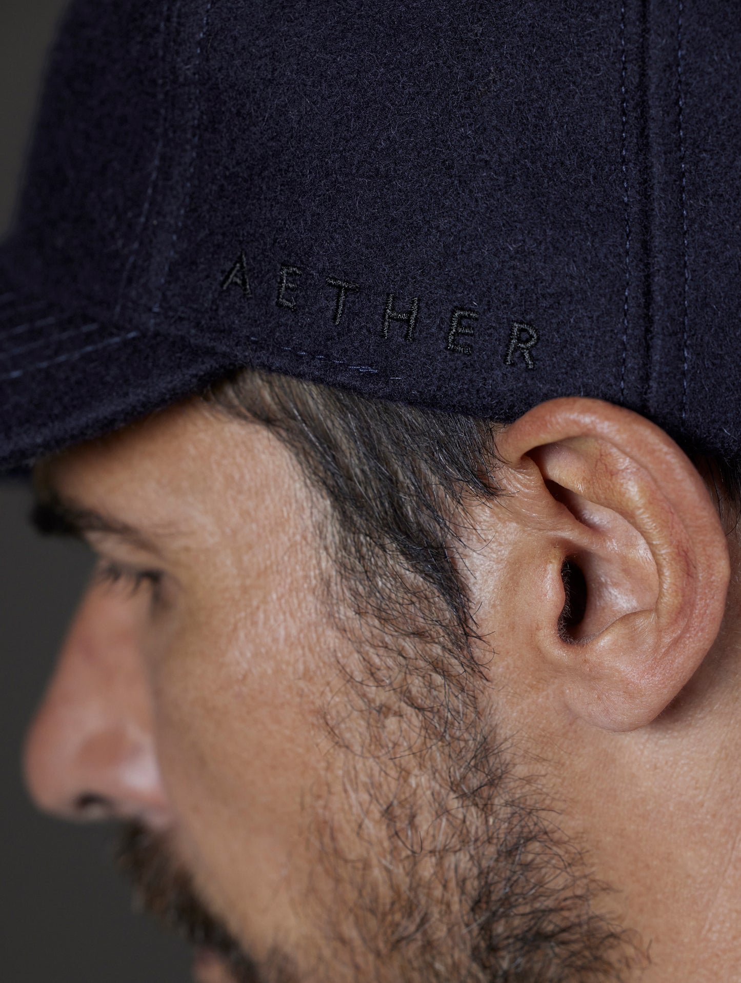 Closeup detailed view of construction of AETHER Wool Hat in Total Eclipse dark blue from AETHER Apparel.