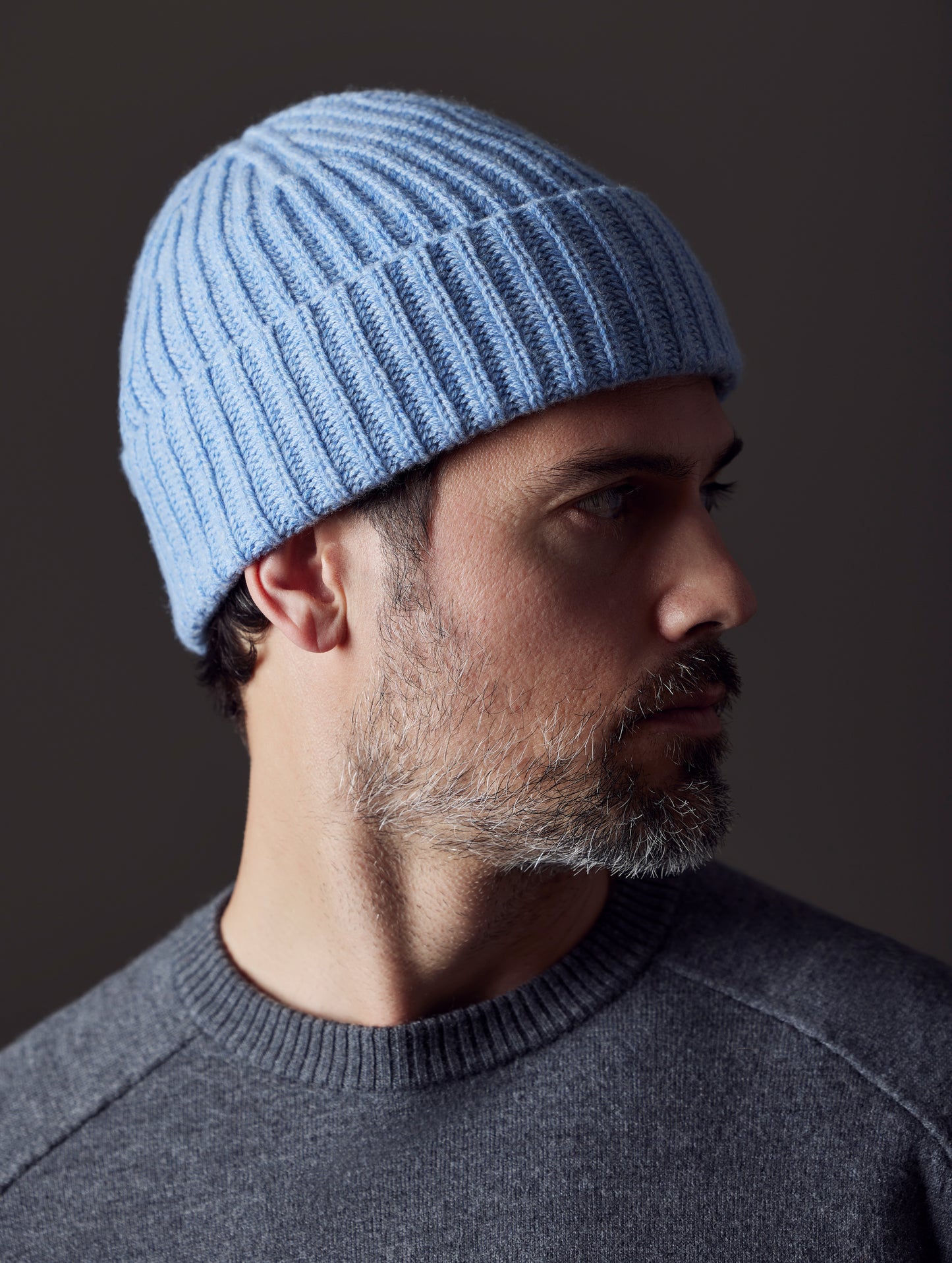 Side profile view of man wearing Cashmere Hat in Light Blue Heather from AETHER Apparel.