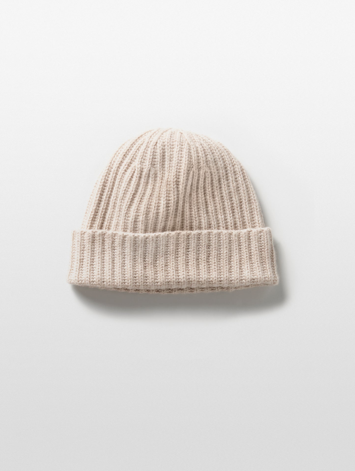 Flat lay of Cashmere Hat in Oatmeal Heather from AETHER Apparel.