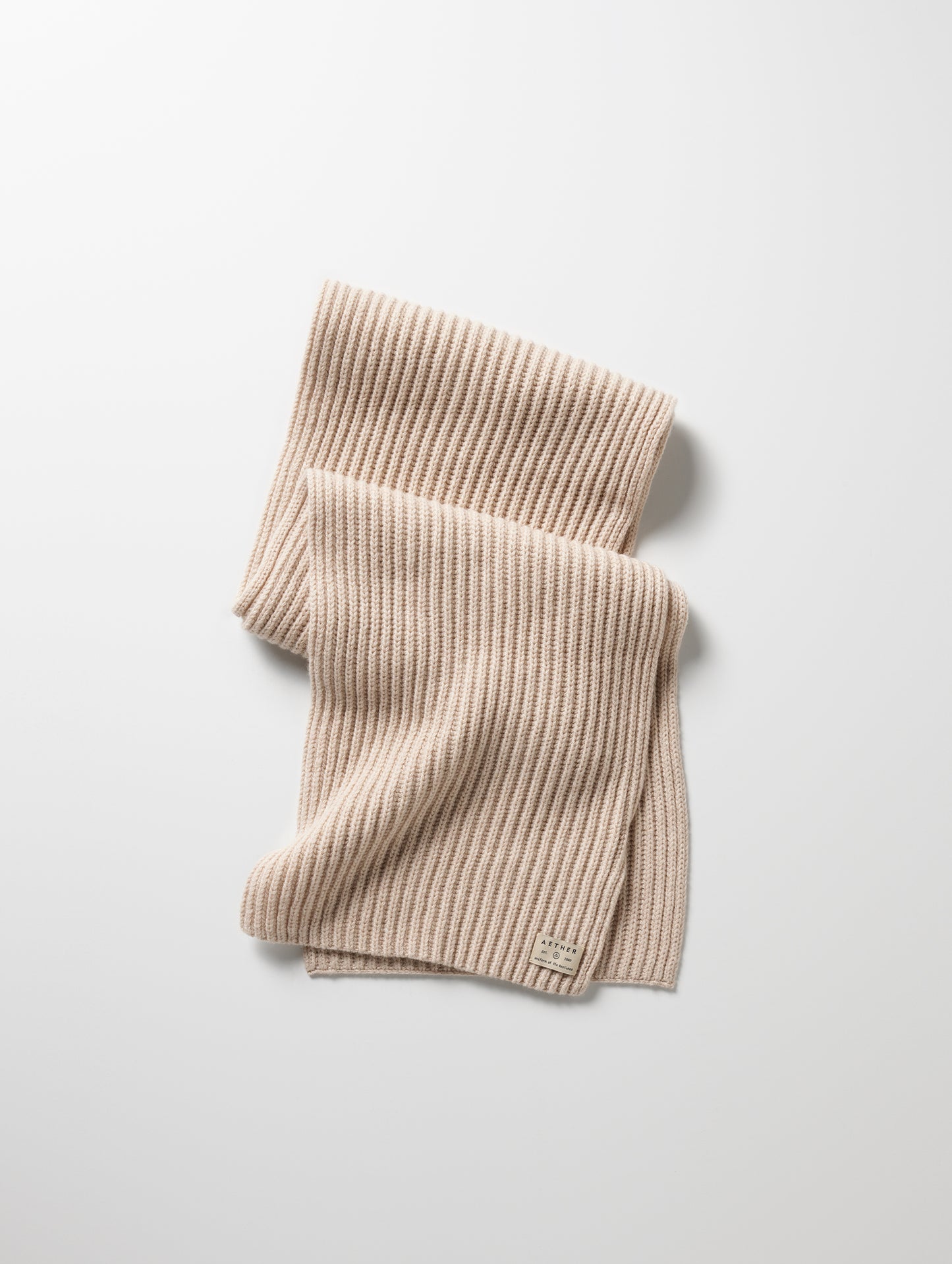 Flat lay of Ribbed Cashmere Scarf in Oatmeal Heather from AETHER Apparel.