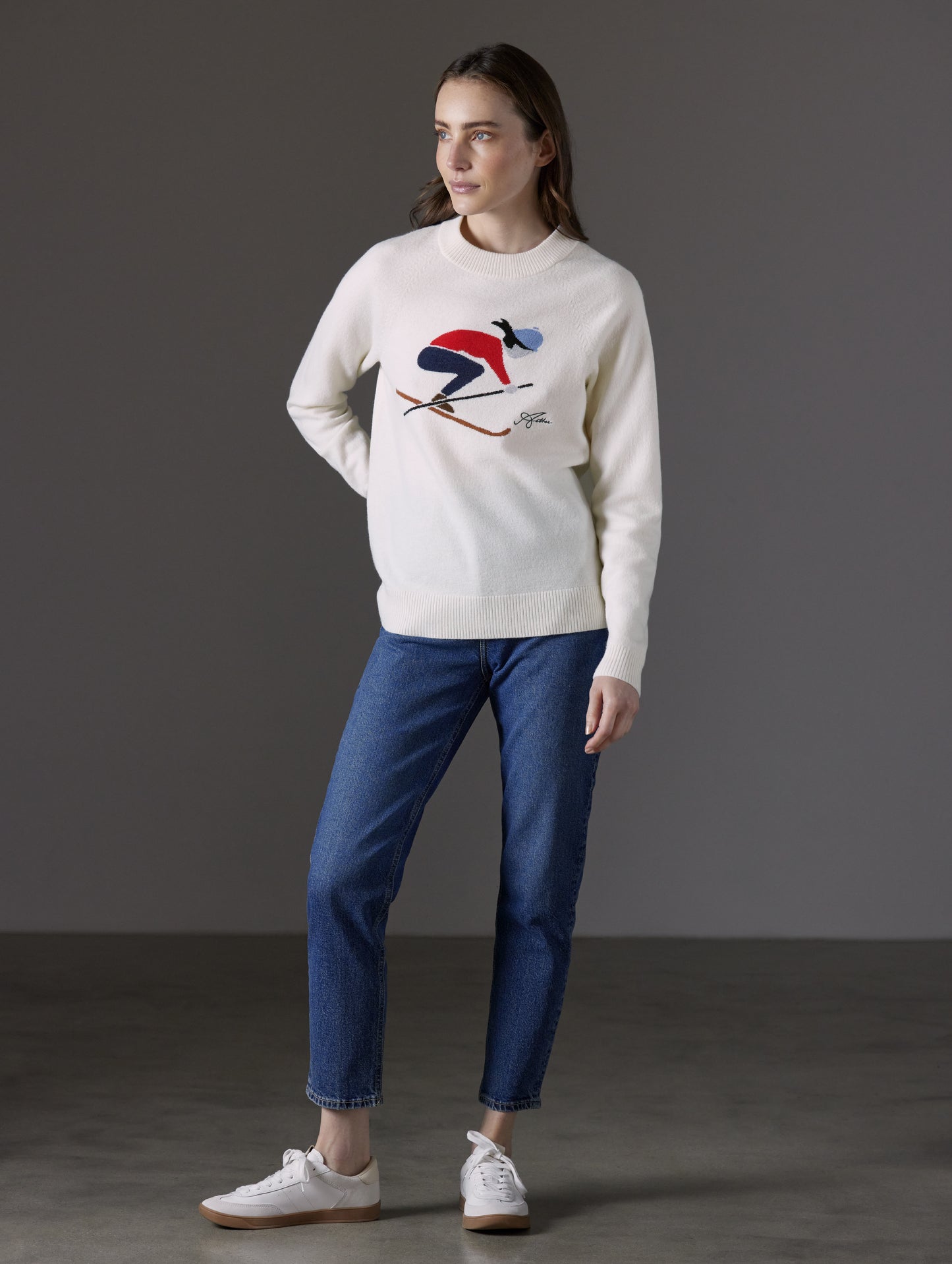 Front angled full-body view of woman wearing Bridget Sweater in Winter White from AETHER Apparel.