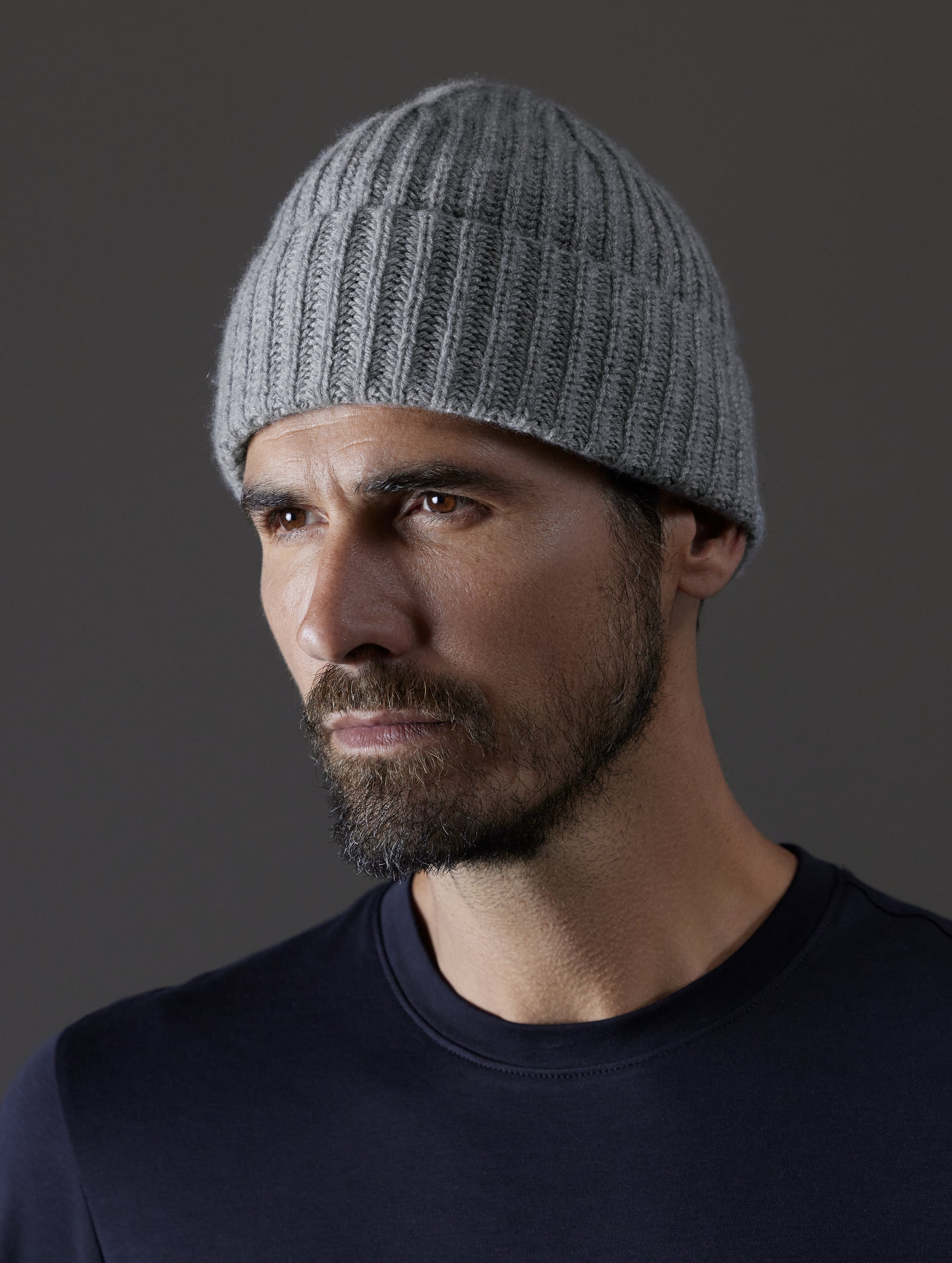 Front angled view of man wearing Cashmere Hat in Heather Grey from AETHER Apparel.