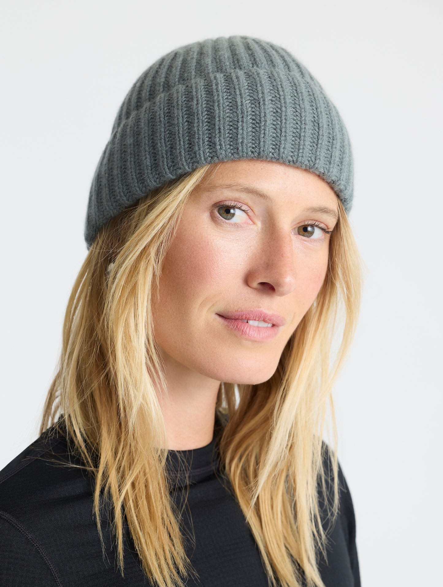 Front angled view of woman wearing the Cashmere Hat in Gunmetal from AETHER Apparel.