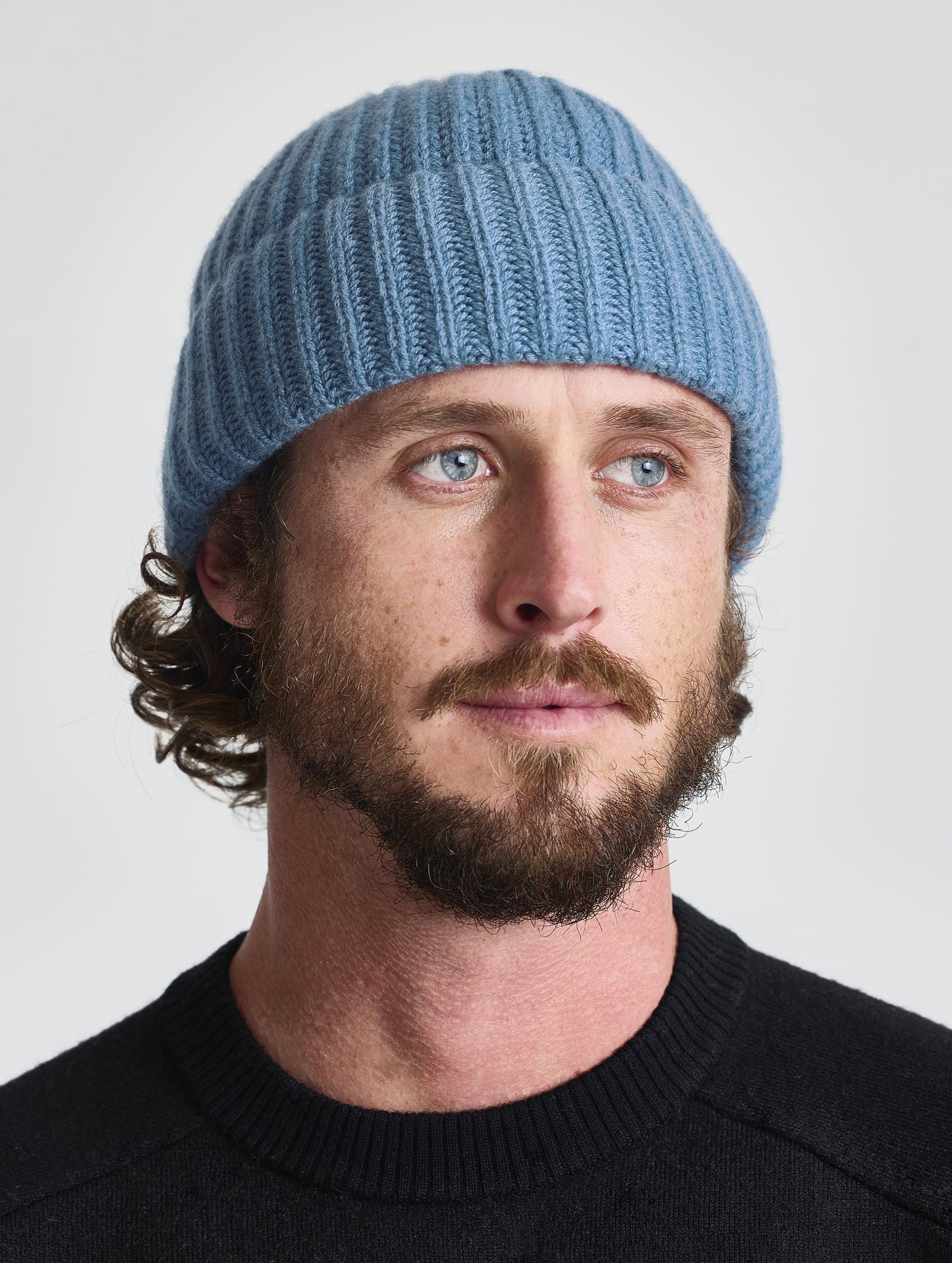 Front view of man wearing the Cashmere Hat in Portal Blue from AETHER Apparel.