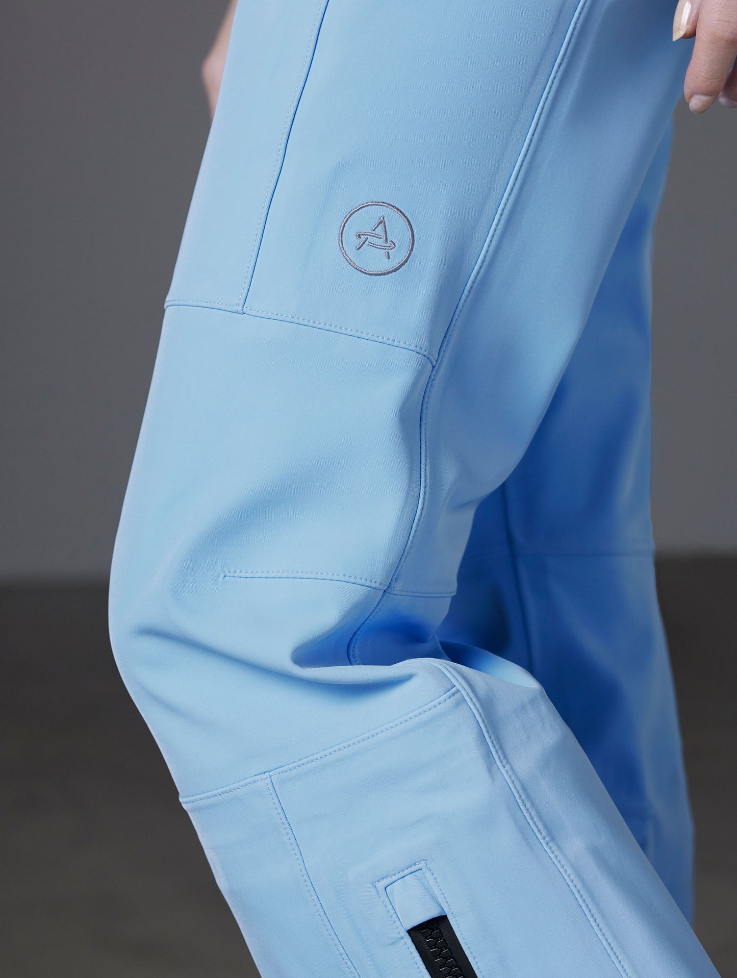 Closeup detailed view of the articulation-bolstering knee darts on the Descent Pant in Atlas Blue from AETHER Apparel.