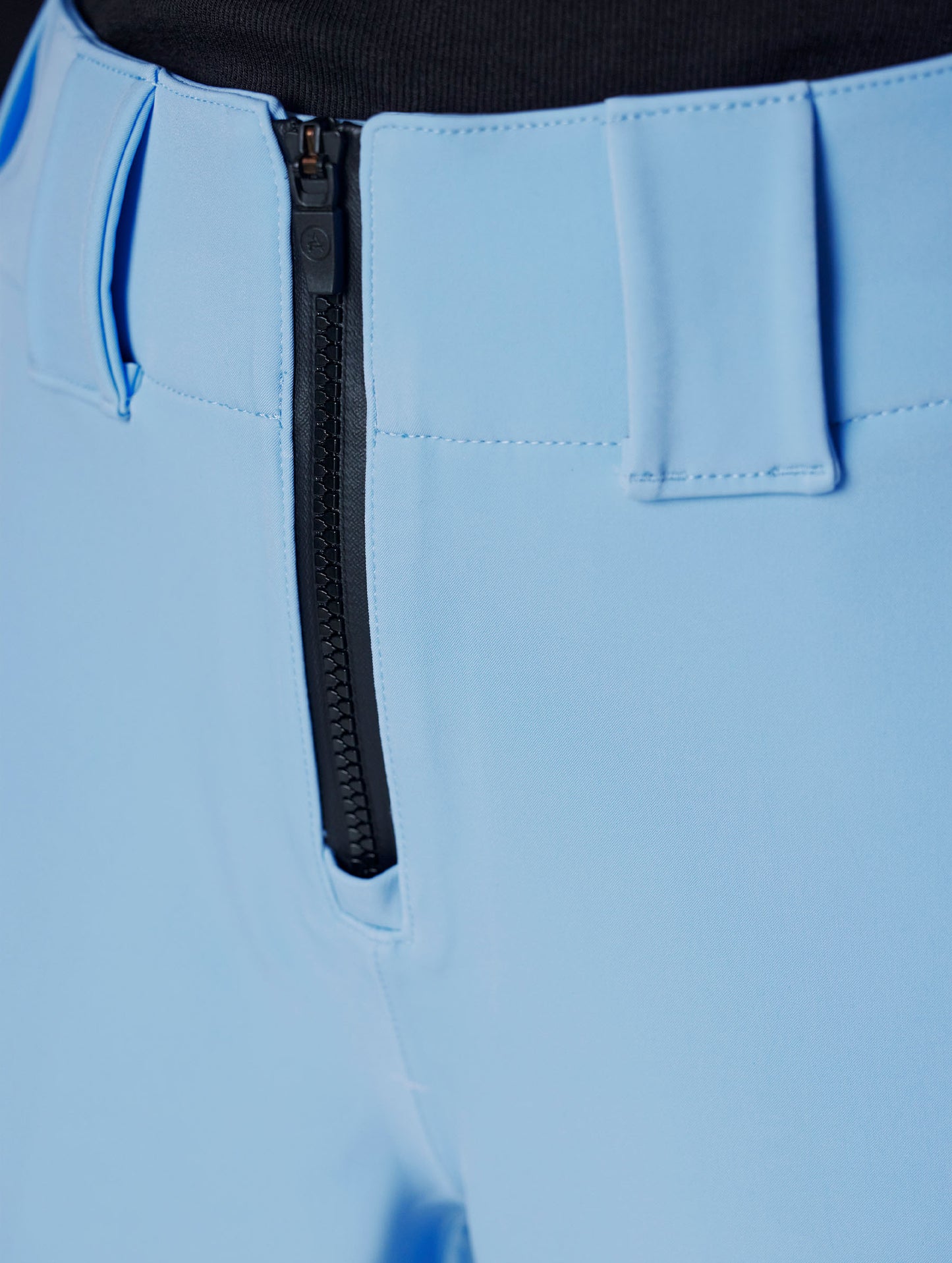 Closeup detailed view of the exposed #5 Aquaguard center front zipper on the Descent Pant in Atlas Blue from AETHER Apparel.