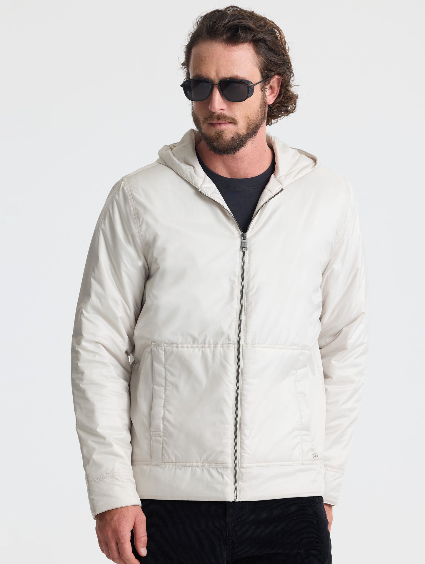 Front view of man wearing Eco Space Hoodie in Bone white from AETHER Apparel.