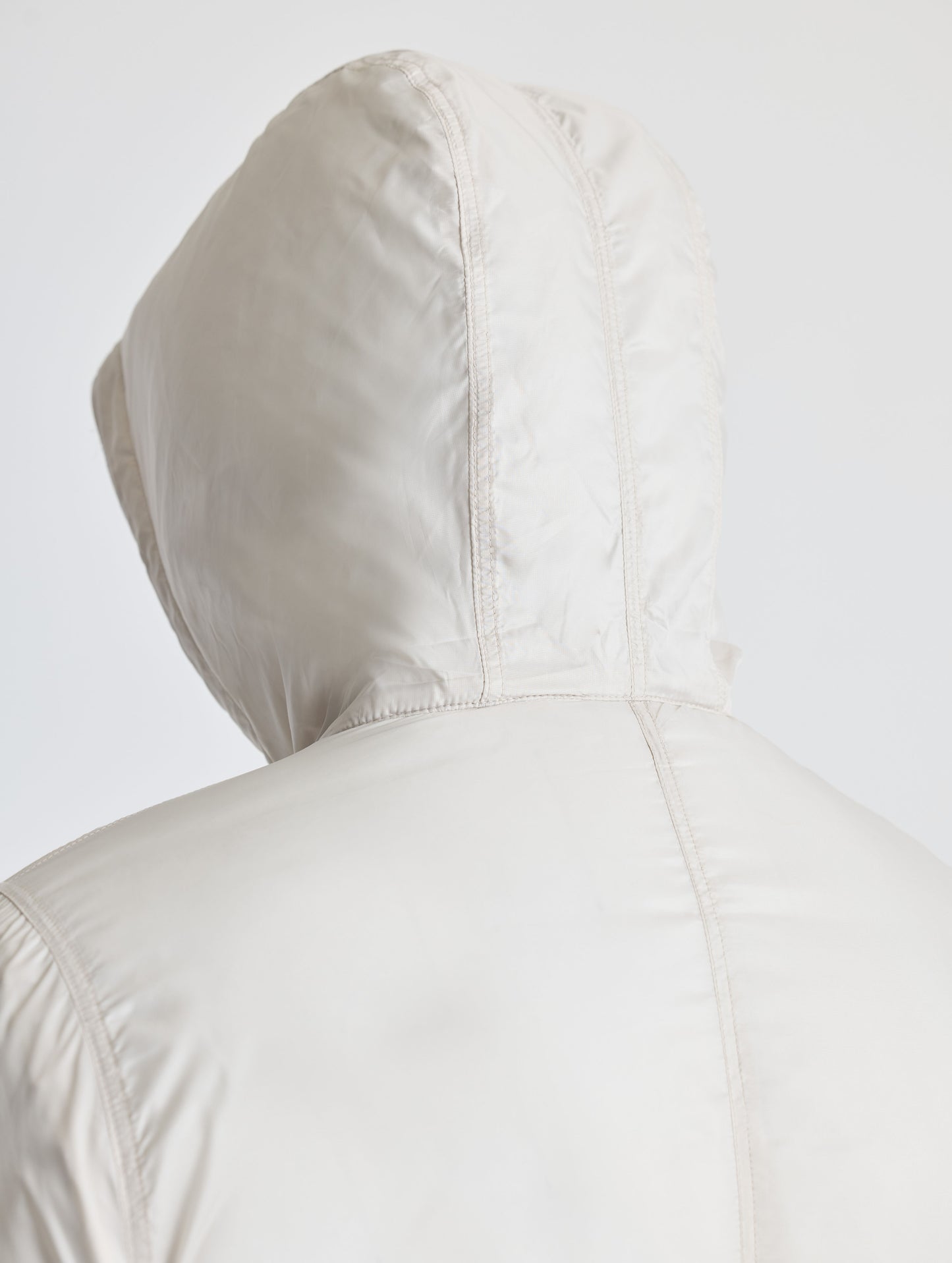 Closeup rear detail view of hood of Eco Space Hoodie in Bone white from AETHER Apparel.
