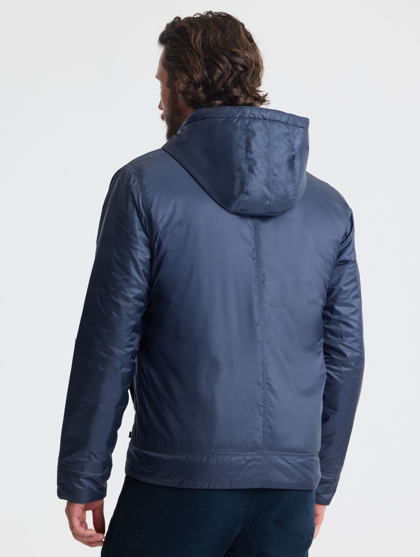 Rear view of man wearing Eco Space Hoodie in Total Eclipse dark blue from AETHER Apparel.
