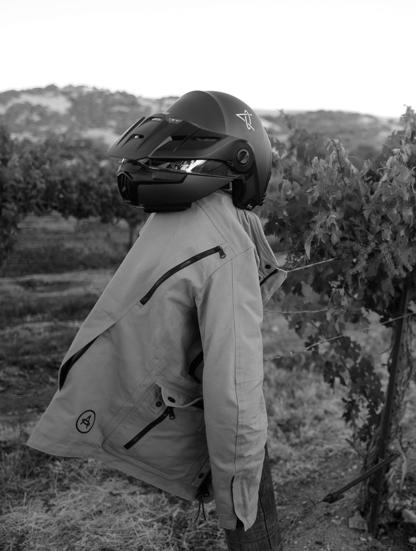 AETHER helmet and motorcycle jacket nested amongst nature in Paso Robles, California.
