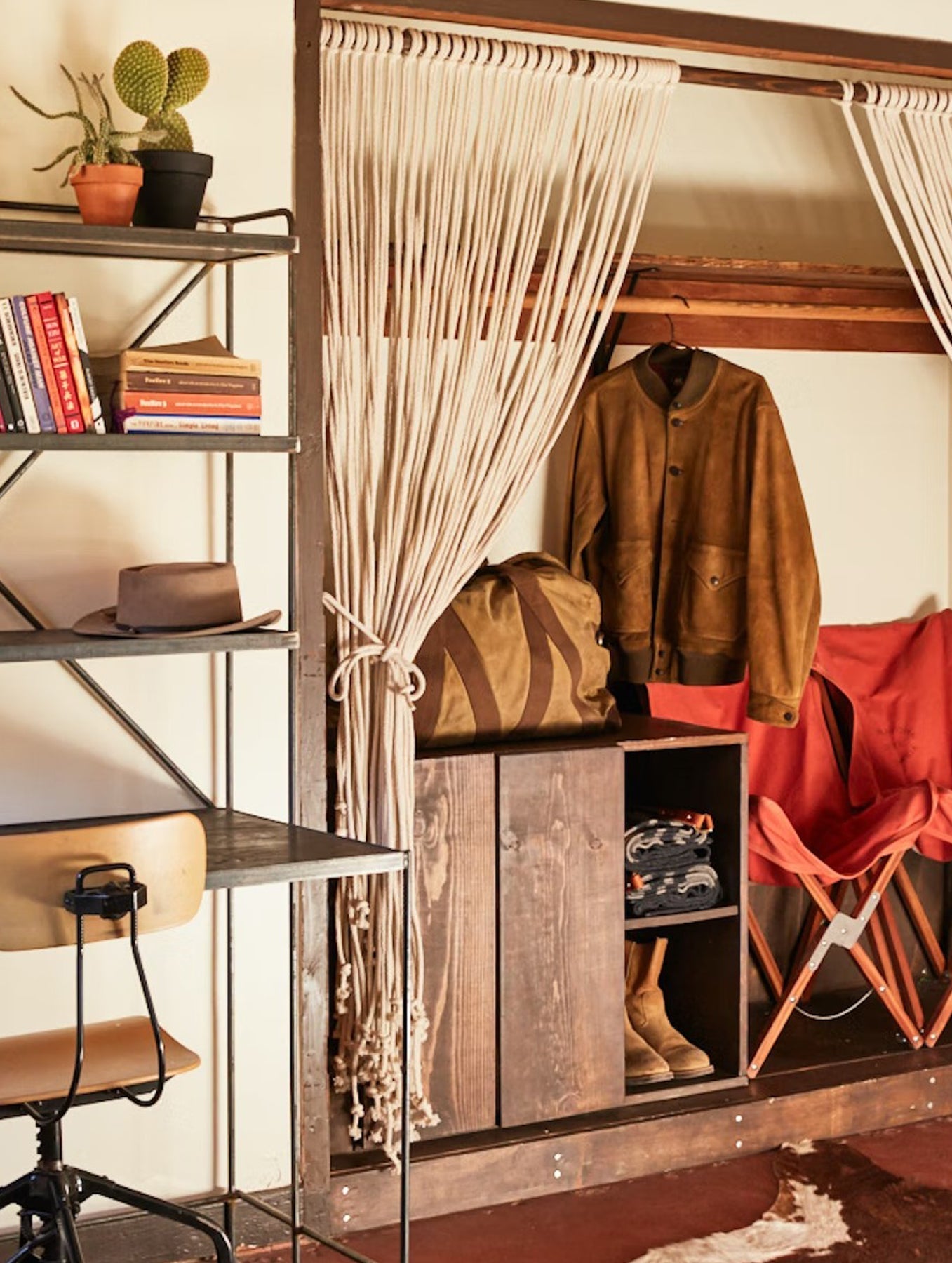 Closet view and desk with shelves in bedroom in Pioneertown Motel in California.