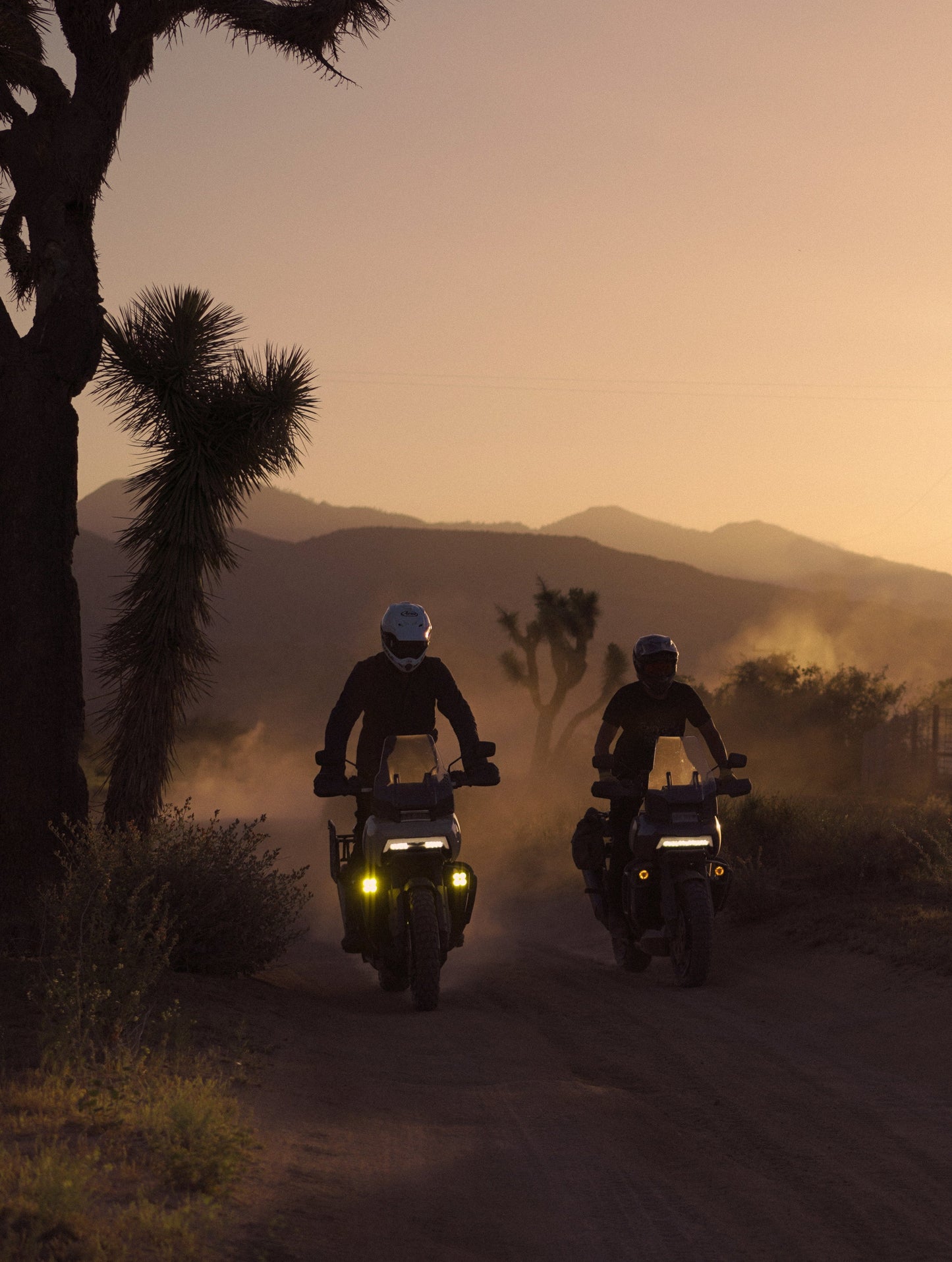 Two men riding motorcycles in Pioneertown, California.