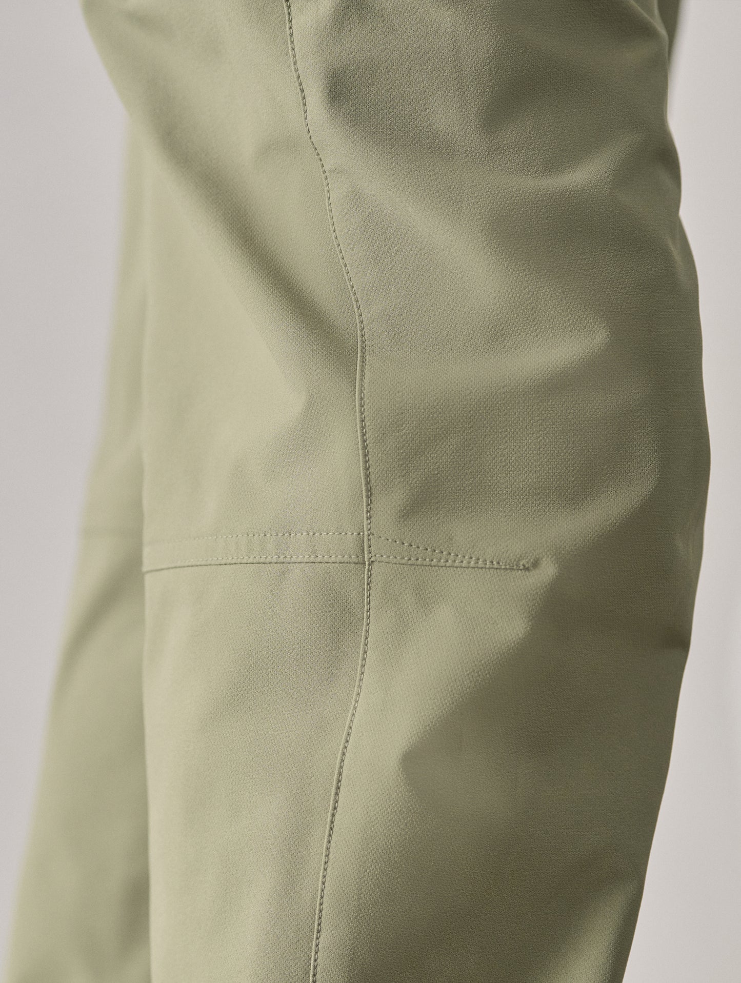Closeup detailed image of knee darts on Adventure Pant in Fern Green from AETHER Apparel.