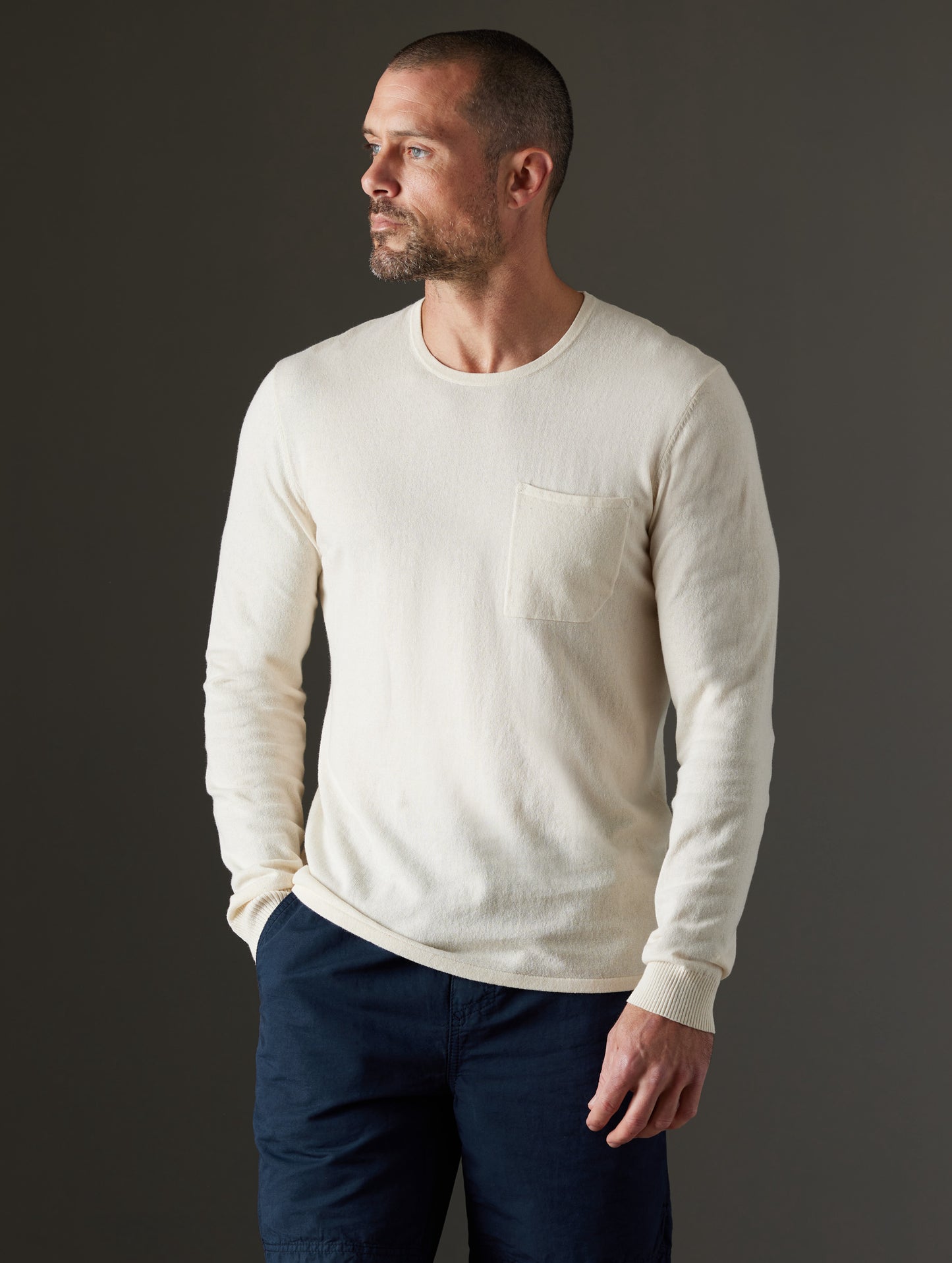 Front body view of man wearing Aero Sweater in Oatmeal Heather from AETHER Apparel.