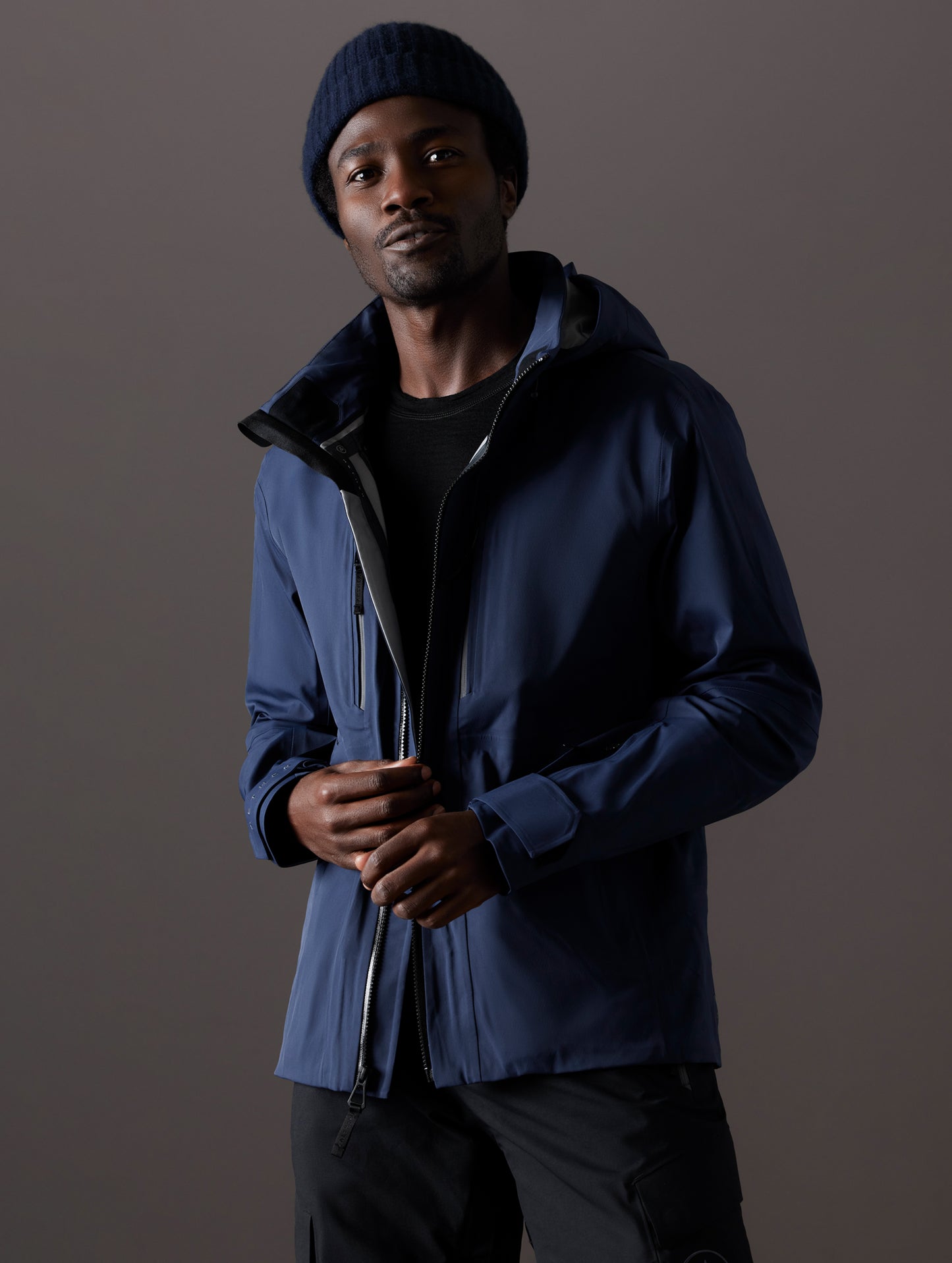 man wearing blue snow shell from AETHER Apparel
