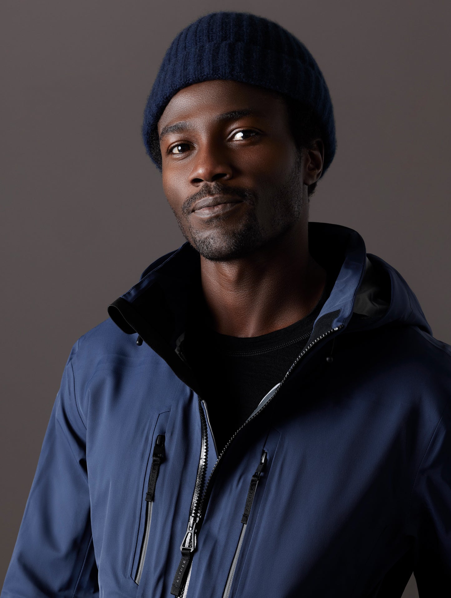 man wearing blue snow shell from AETHER Apparel