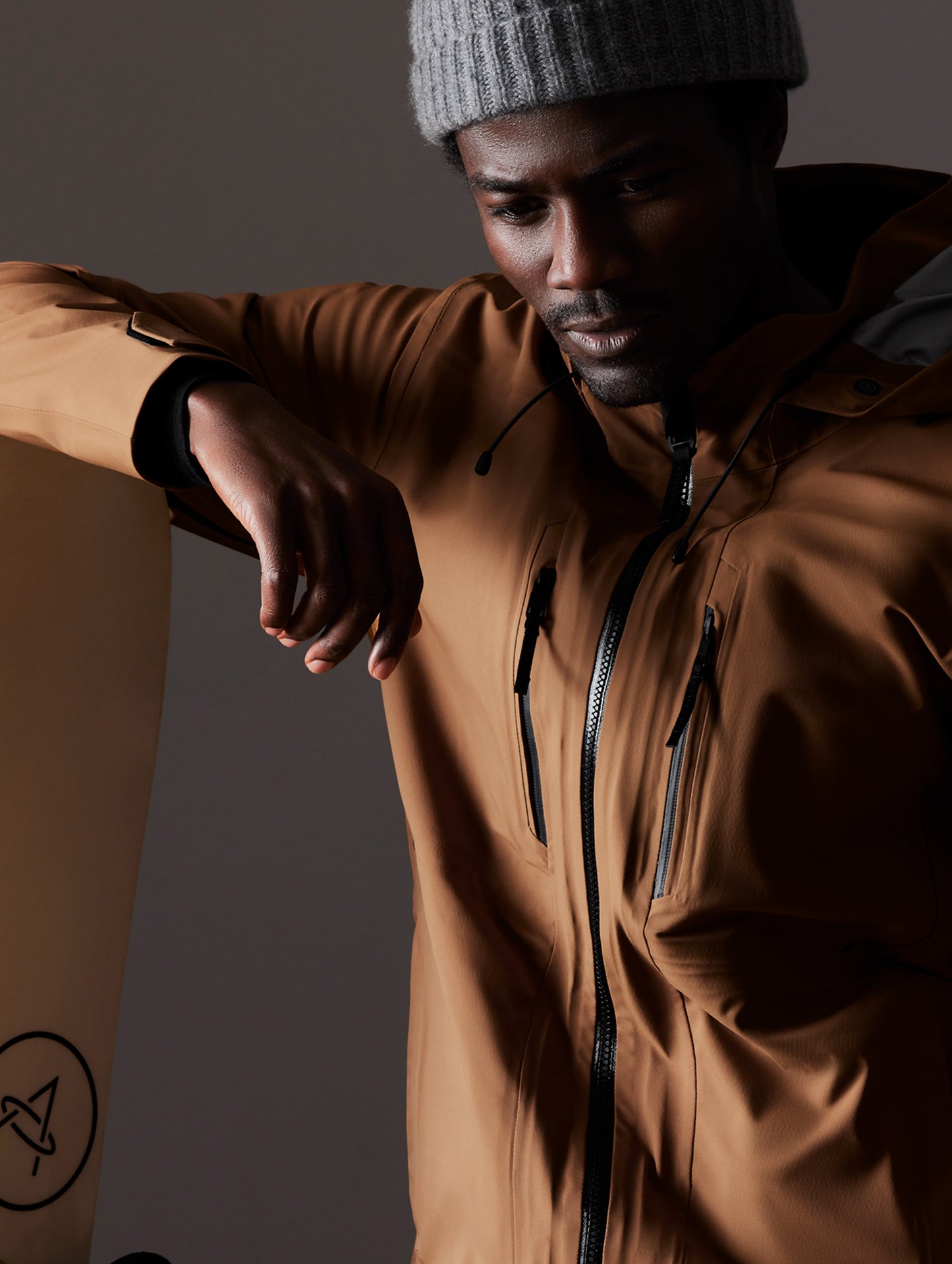 man wearing brown snow shell from AETHER Apparel