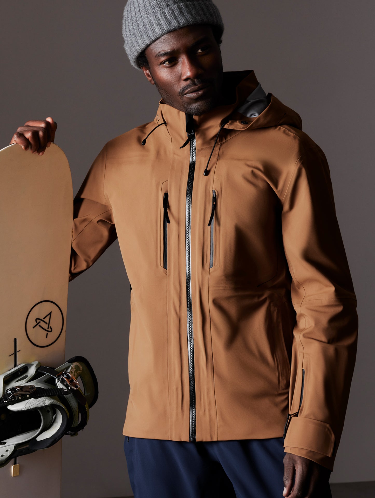 man wearing brown snow shell from AETHER Apparel