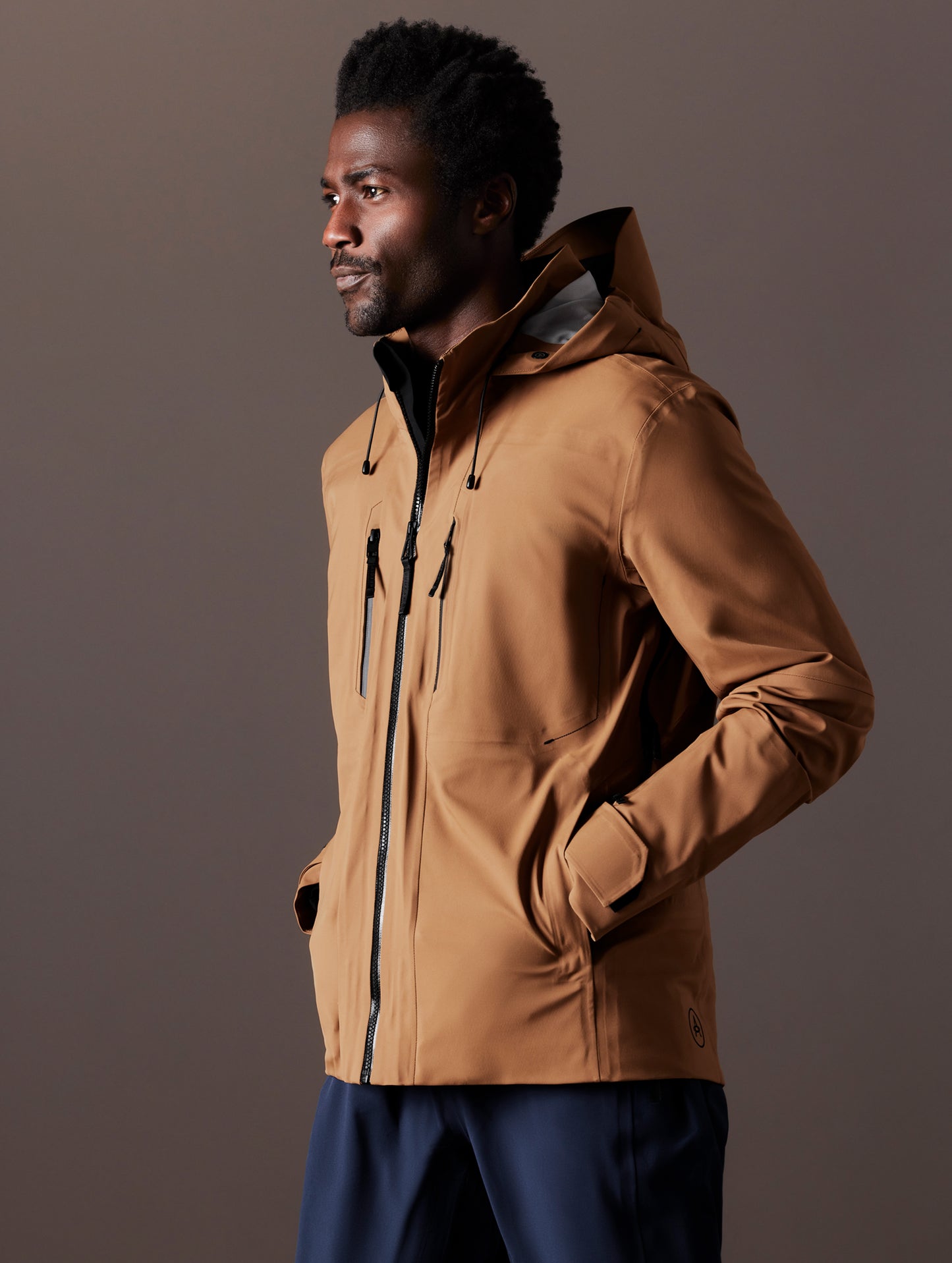 man wearing brown snow shell from AETHER Apparel