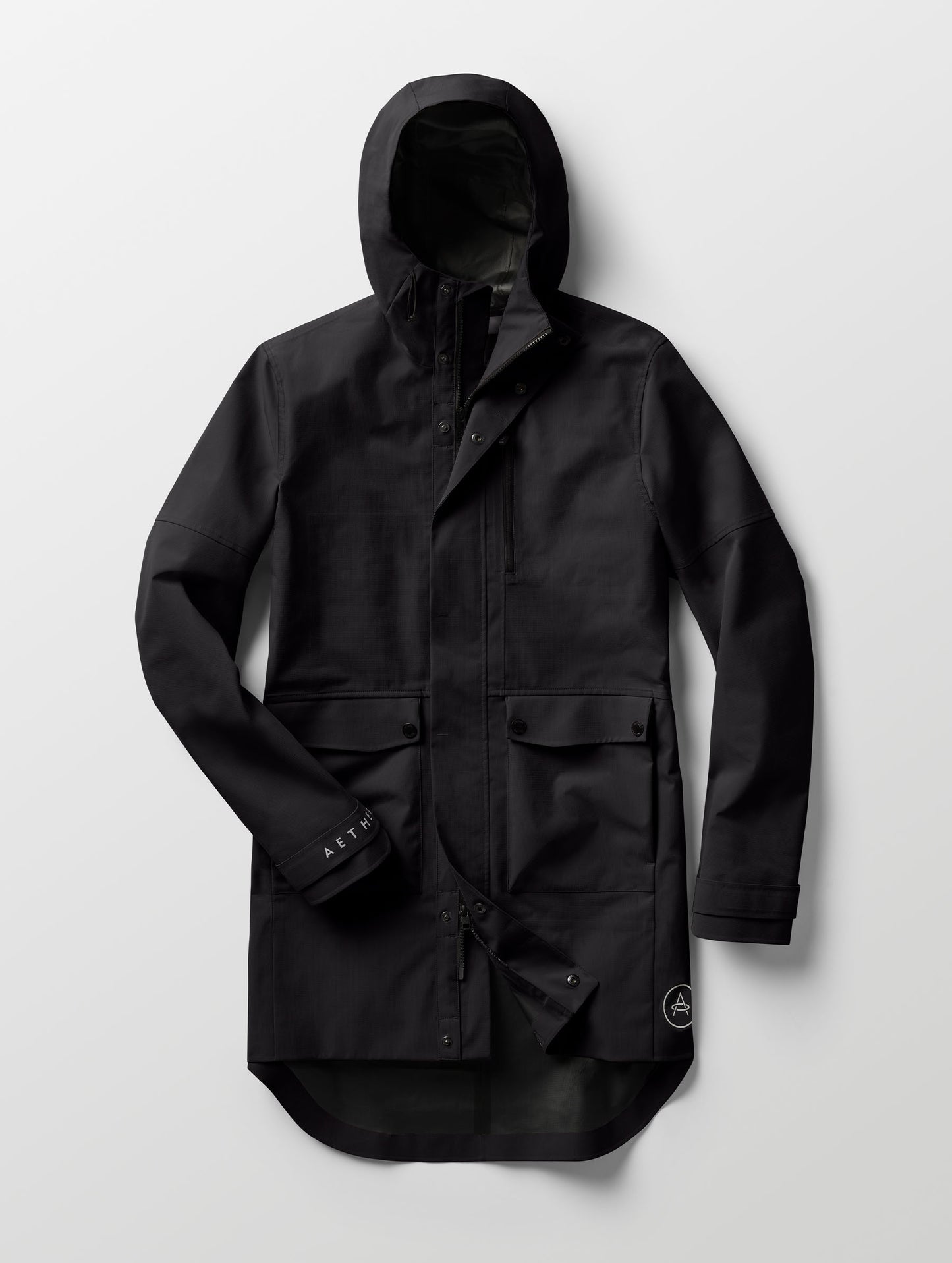 Studio flat lay of the Anders Rain Jacket in Onyx Black from AETHER Apparel.