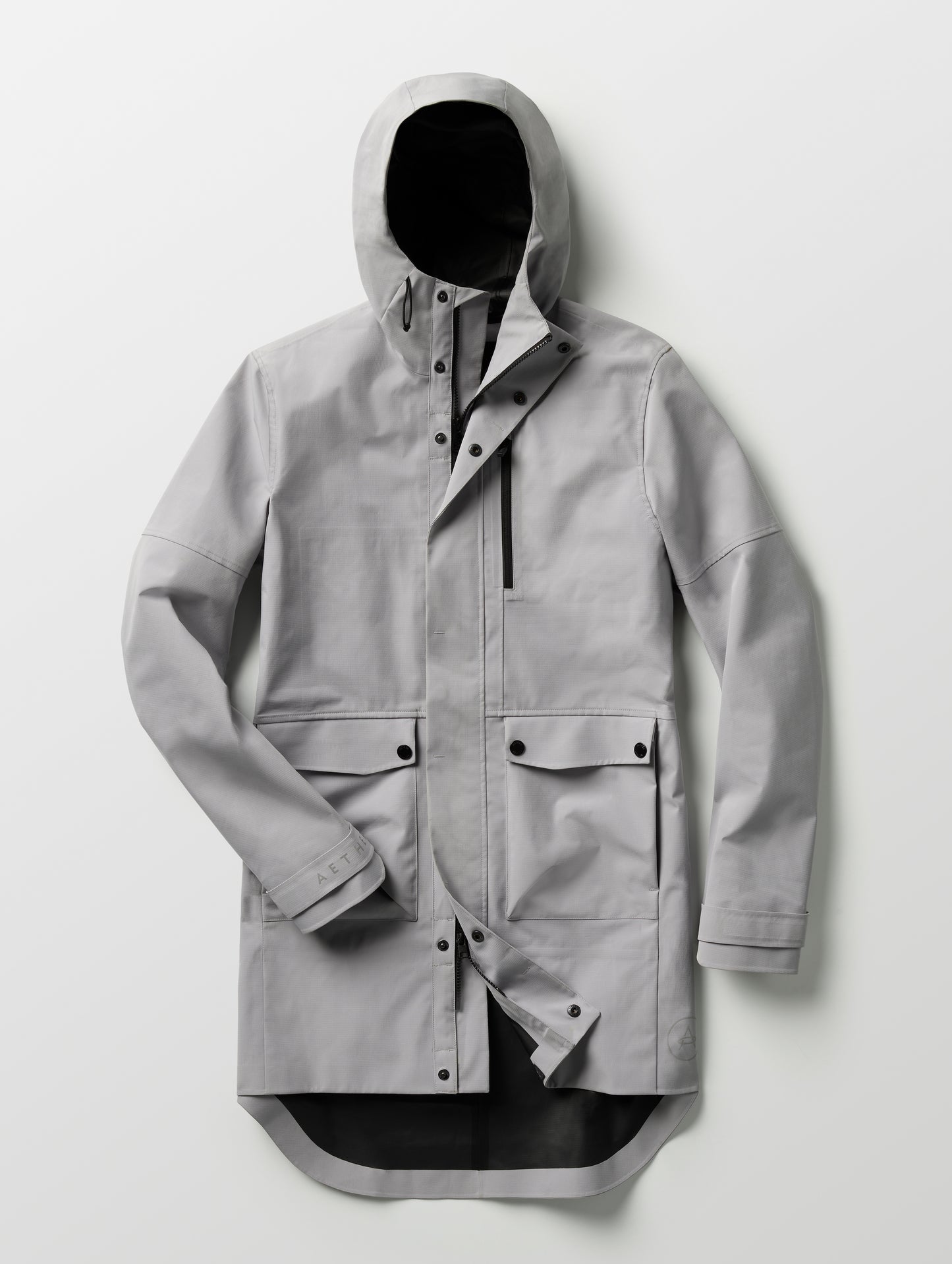 Flat lay of Anders Rain Jacket in Sky Grey from AETHER Apparel.