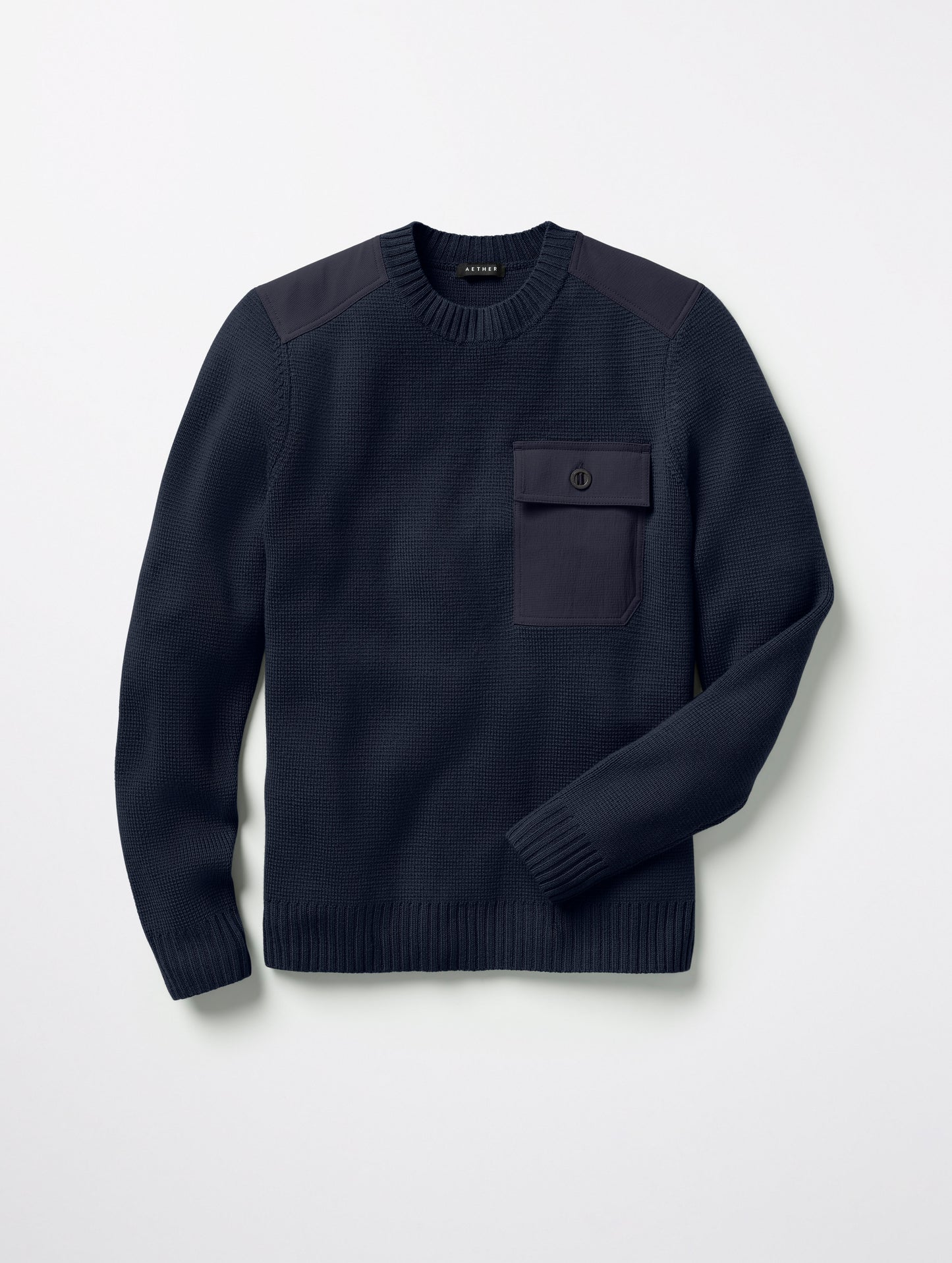 Flat lay of Benson Crewneck Sweater in Total Eclipse dark blue from AETHER Apparel.