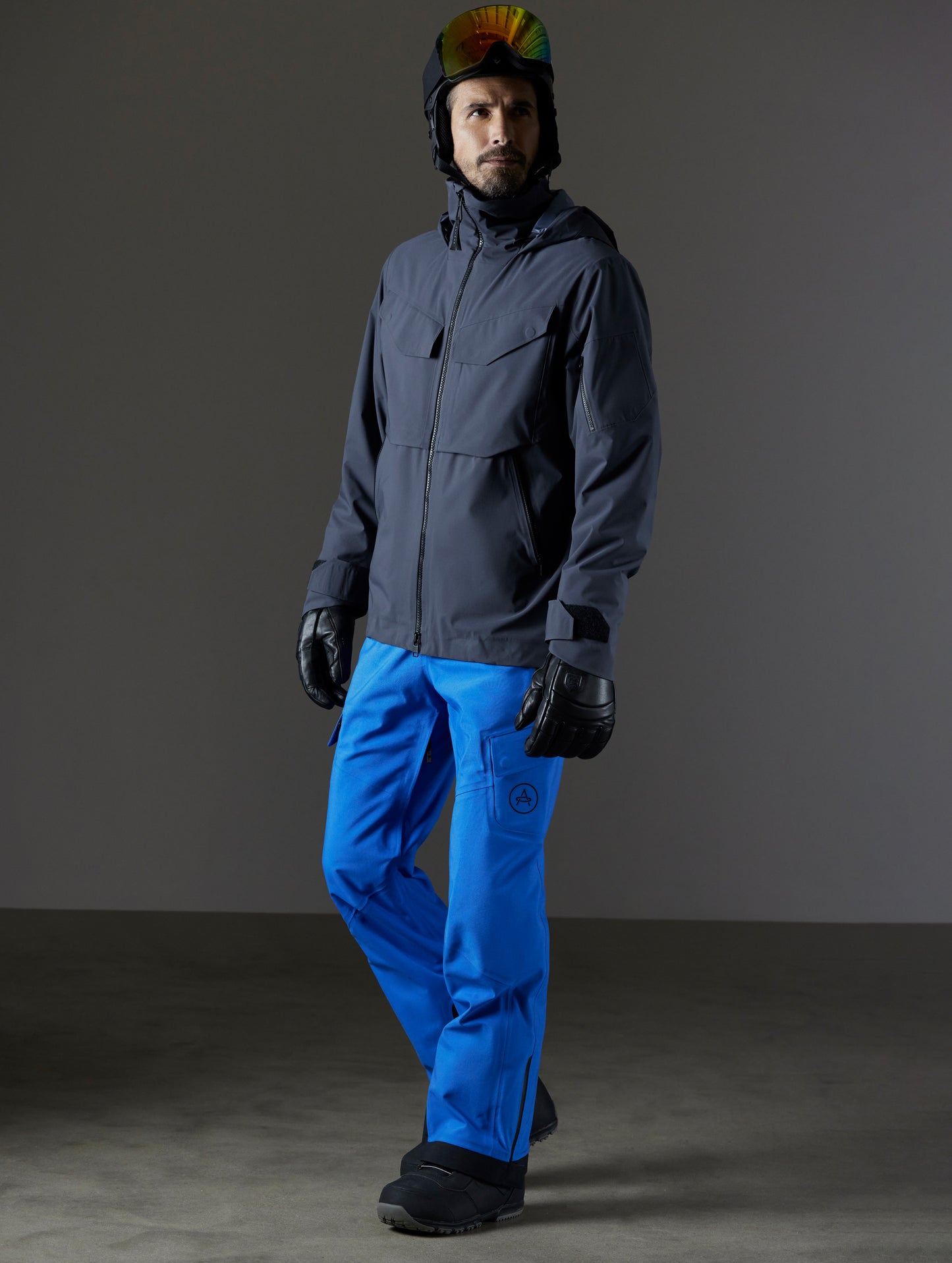 Front 3/4 full-body view of man wearing Brighton Insulated Snow Jacket in Graphite from AETHER Apparel.