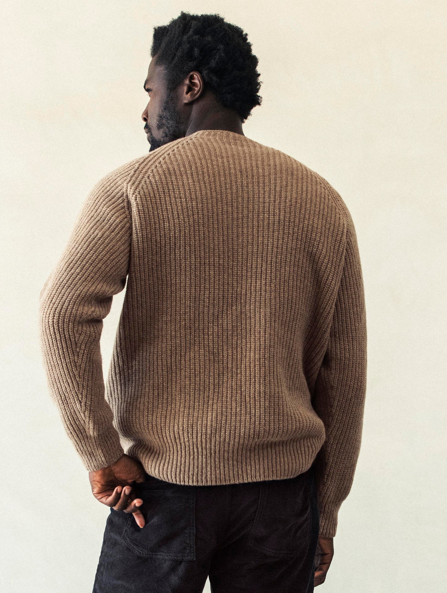 Rear body view of man wearing Camden Crewneck Sweater In Chestnut Brown from AETHER Apparel