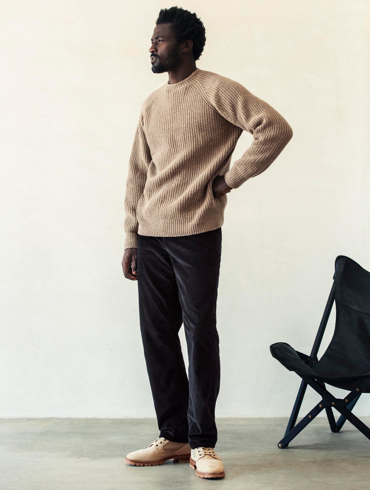 Front 3/4 full-body view of man wearing Camden Crewneck Sweater In Chestnut Brown from AETHER Apparel