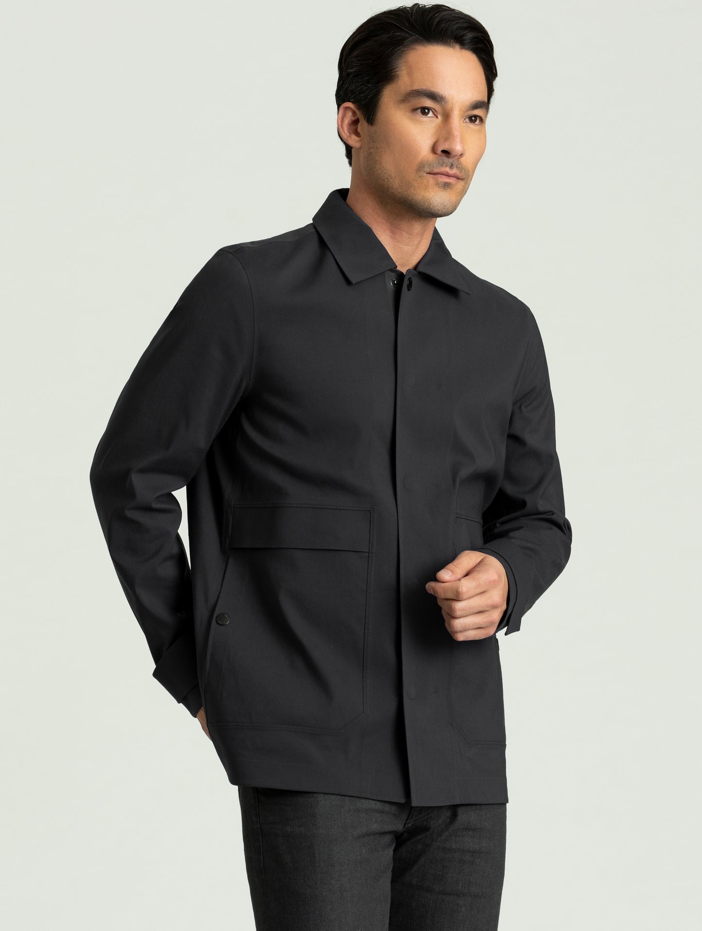 Man wearing black Cole Jacket from AETHER Apparel.