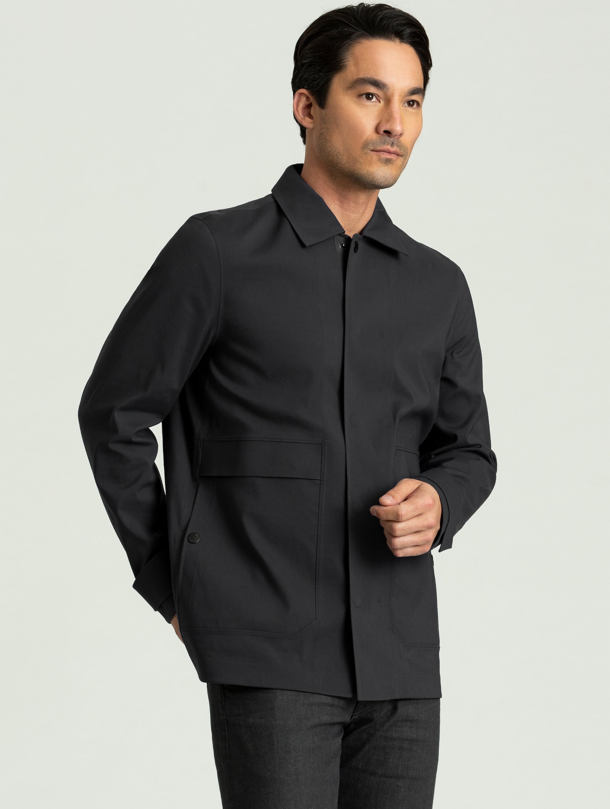 Man wearing black Cole Jacket from AETHER Apparel.