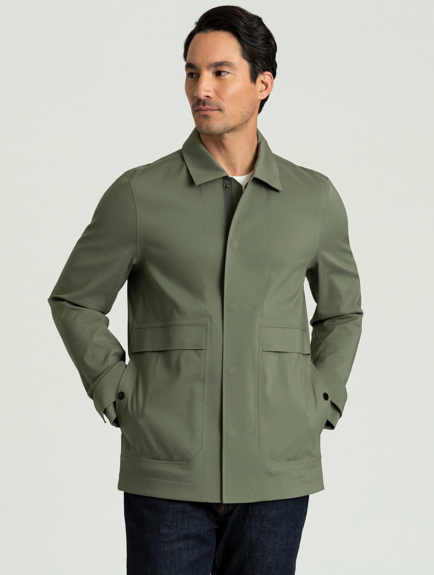 Man wearing Cole Jacket in spruce green from AETHER Apparel.