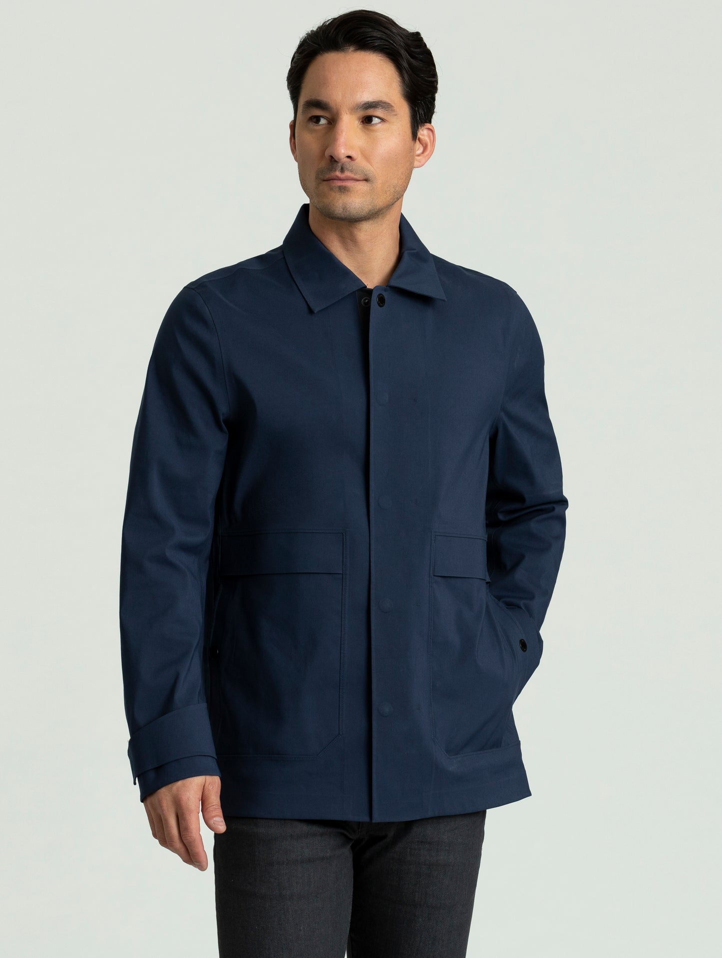 Full front view of man wearing Cole Jacket in dark blue from AETHER Apparel.