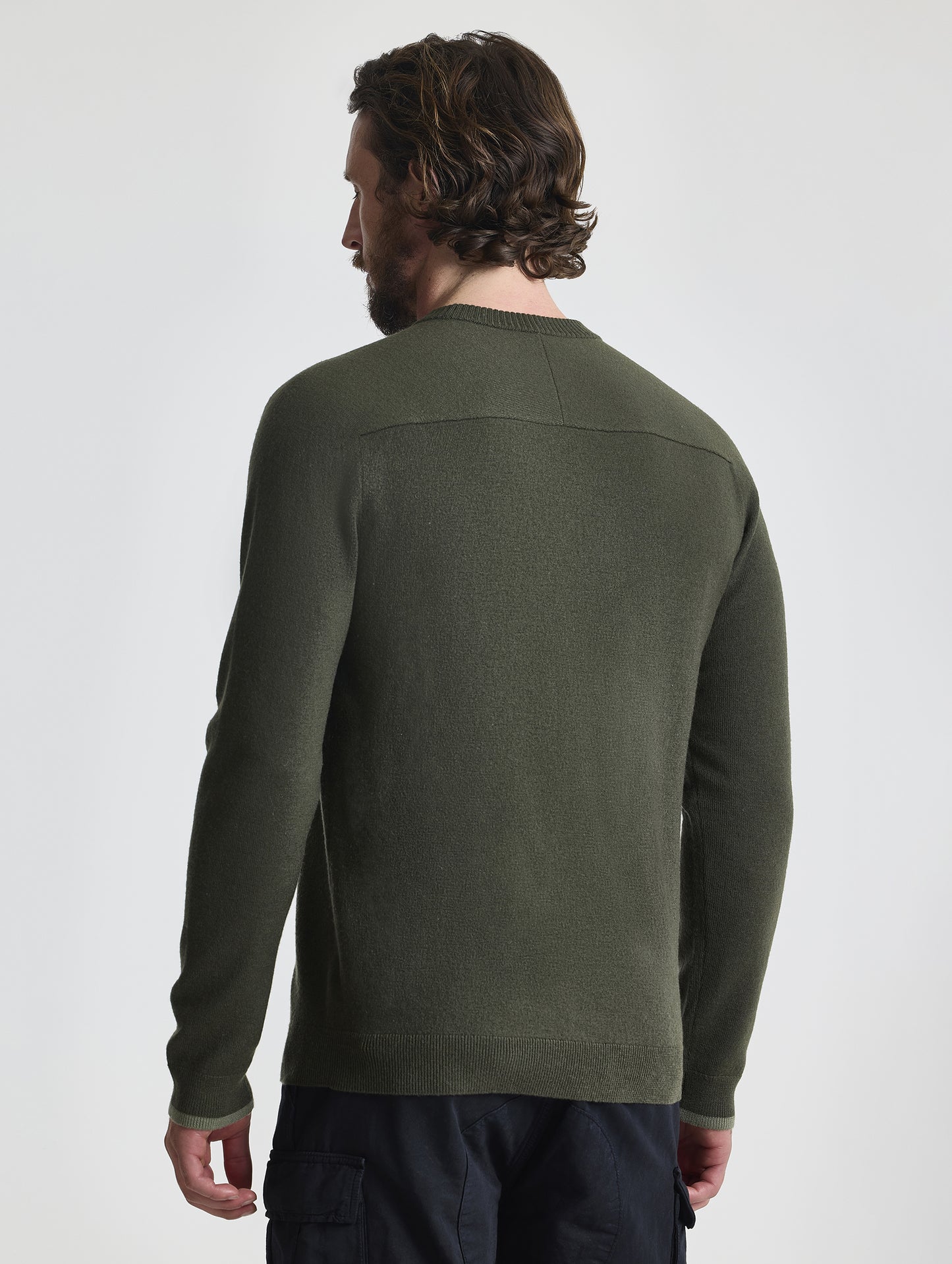 Rear view of man wearing Corbin Sweater in Forest Green from AETHER Apparel.