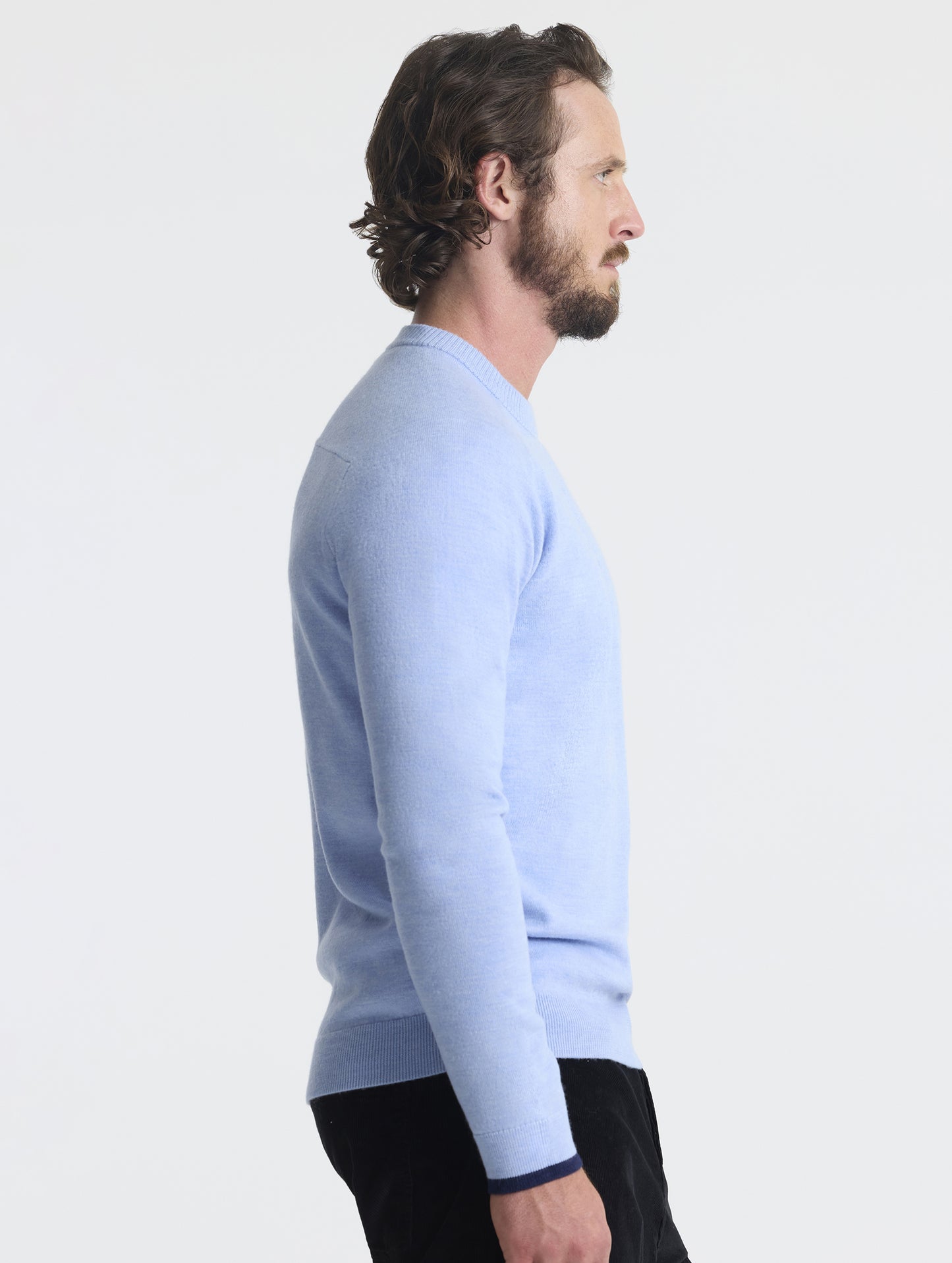 Right profile view of man wearing Corbin Sweater in Light Blue Heather from AETHER Apparel.