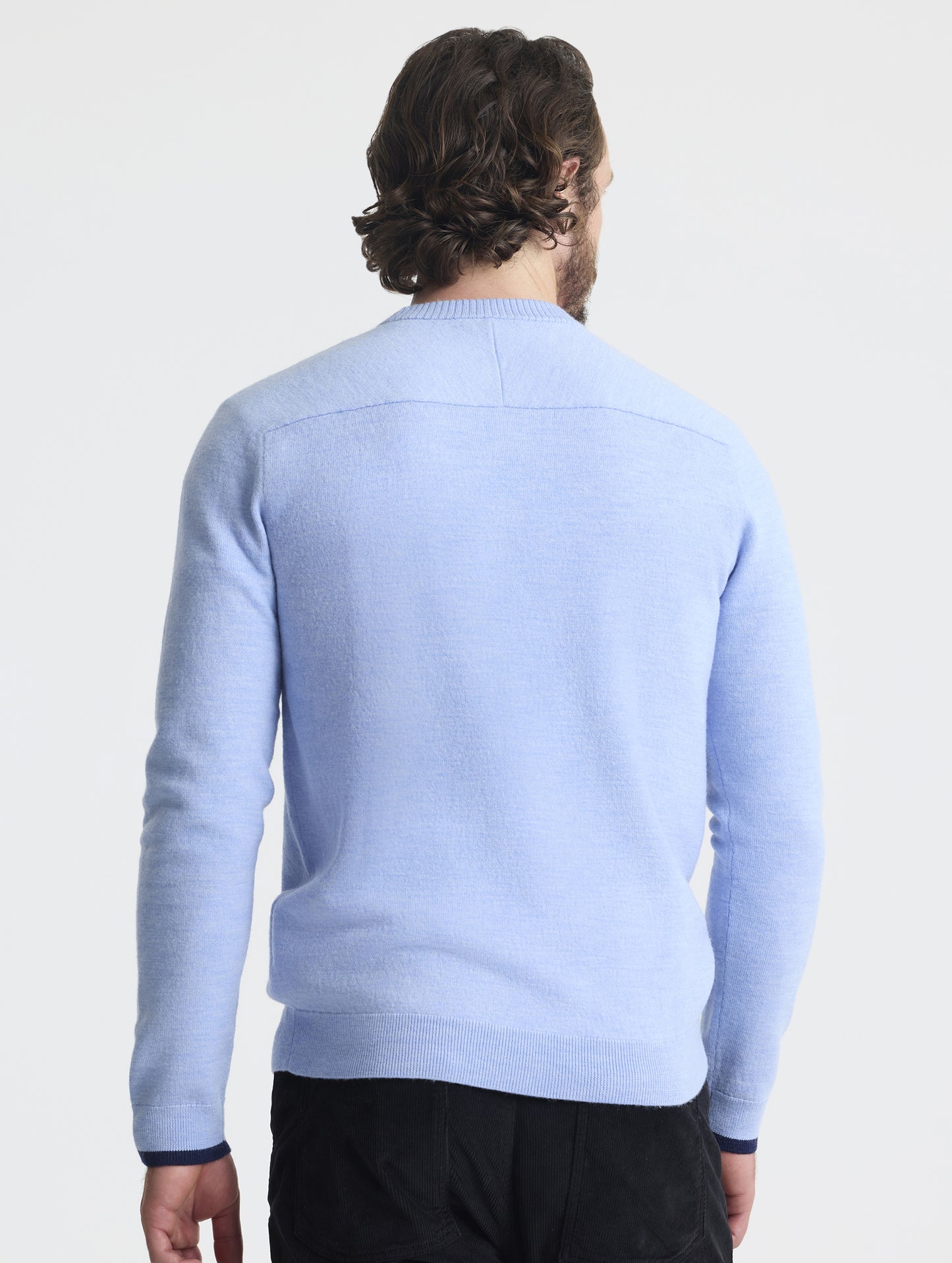 Rear view of man wearing Corbin Sweater in Light Blue Heather from AETHER Apparel.