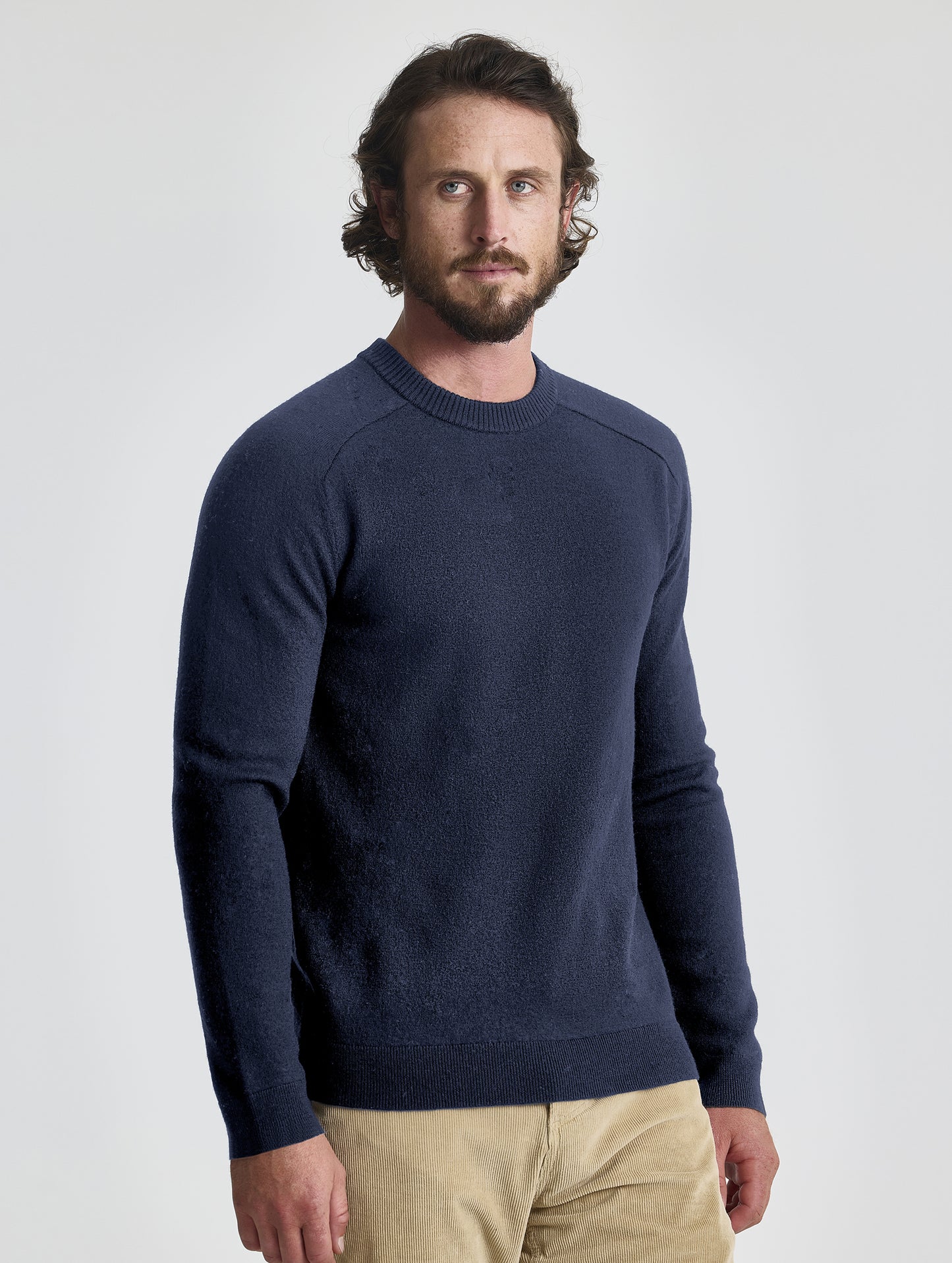 Front view of man wearing Corbin Sweater in Total Eclipse dark blue from AETHER Apparel.