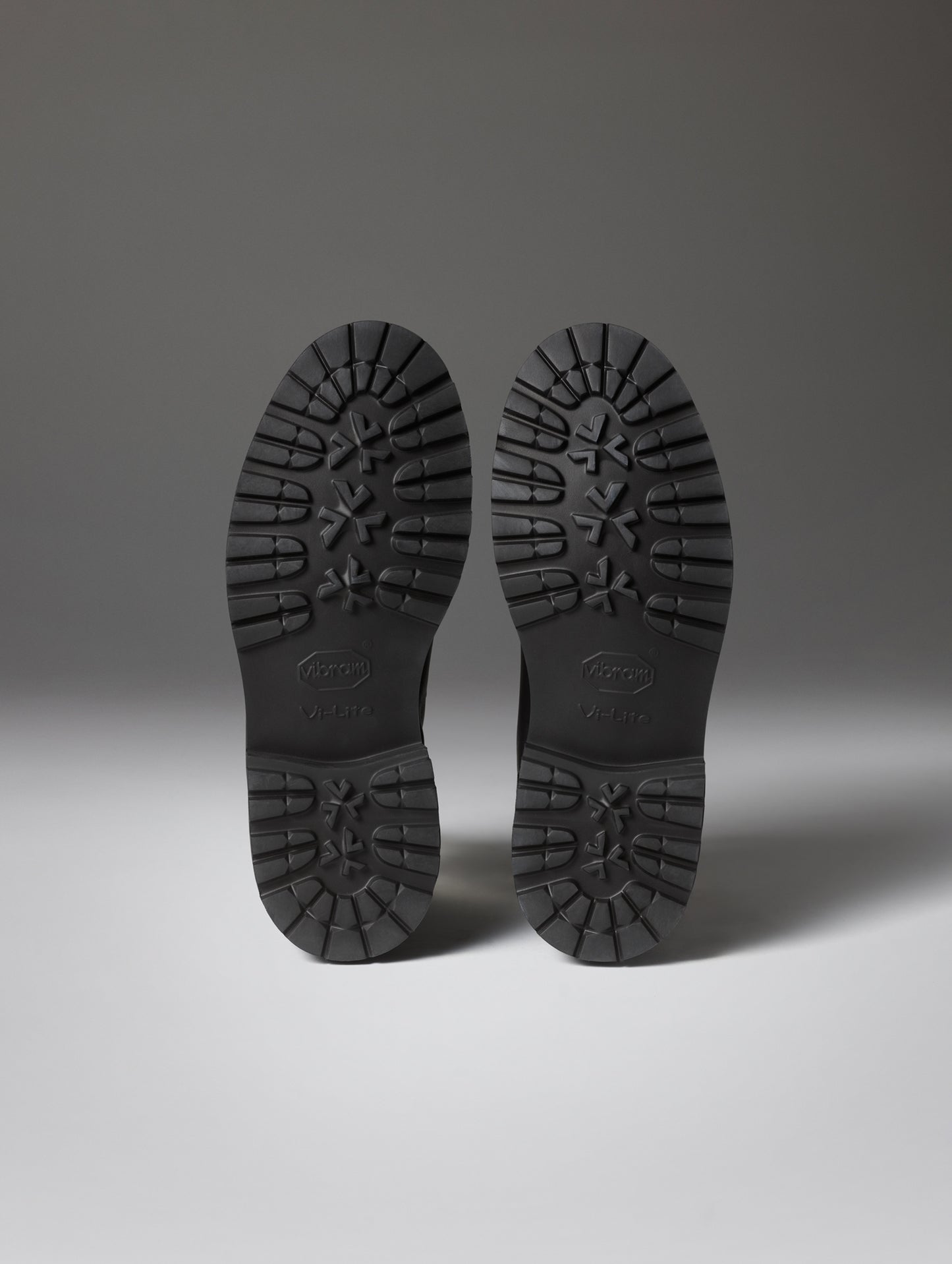 Bottom view of the deep-lug rubber outsoles on men's Dolomite Boot in Espresso Brown from AETHER Apparel.