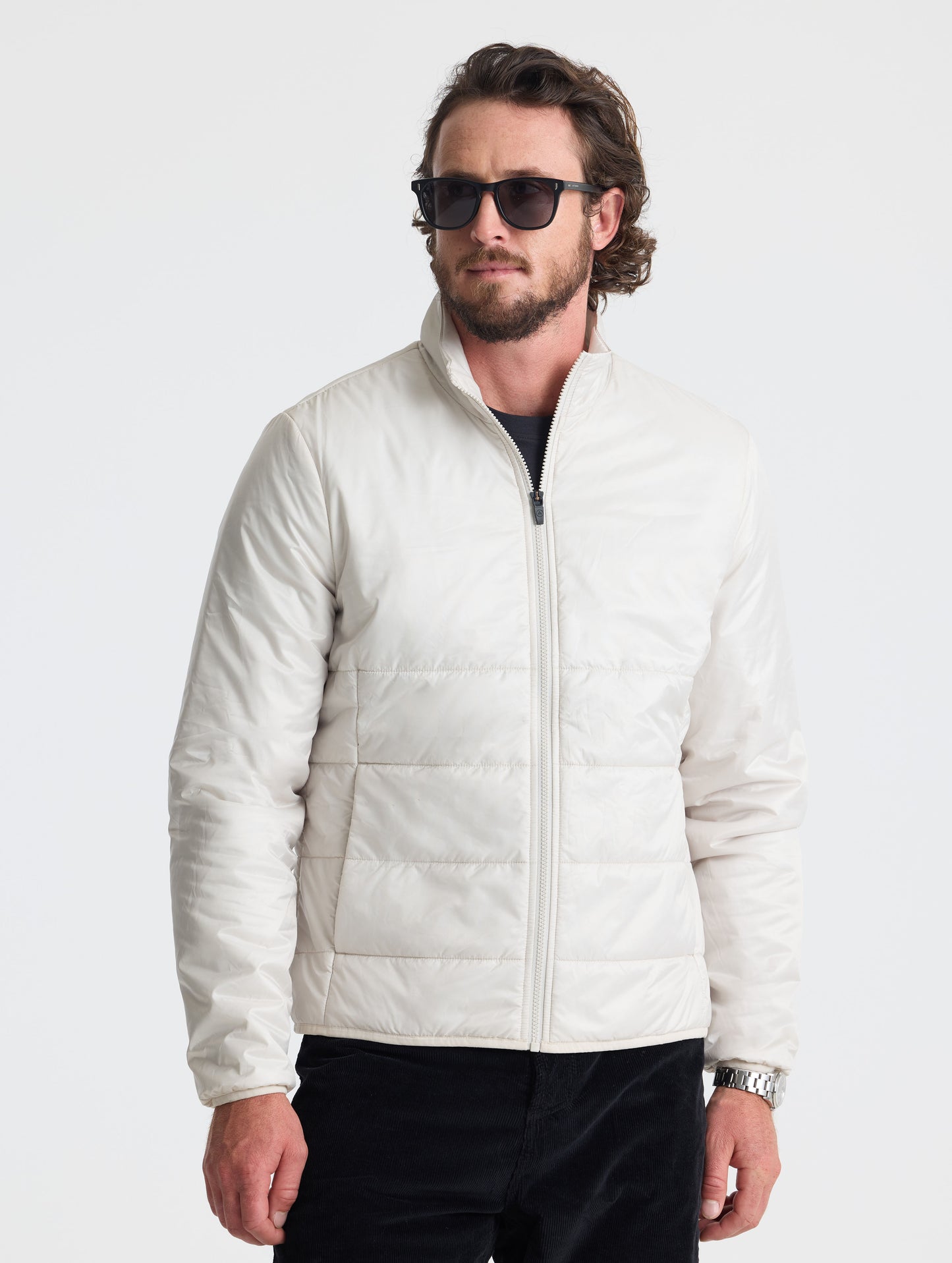Front view of man wearing Eco Insulated Jacket in Bone white from AETHER Apparel.