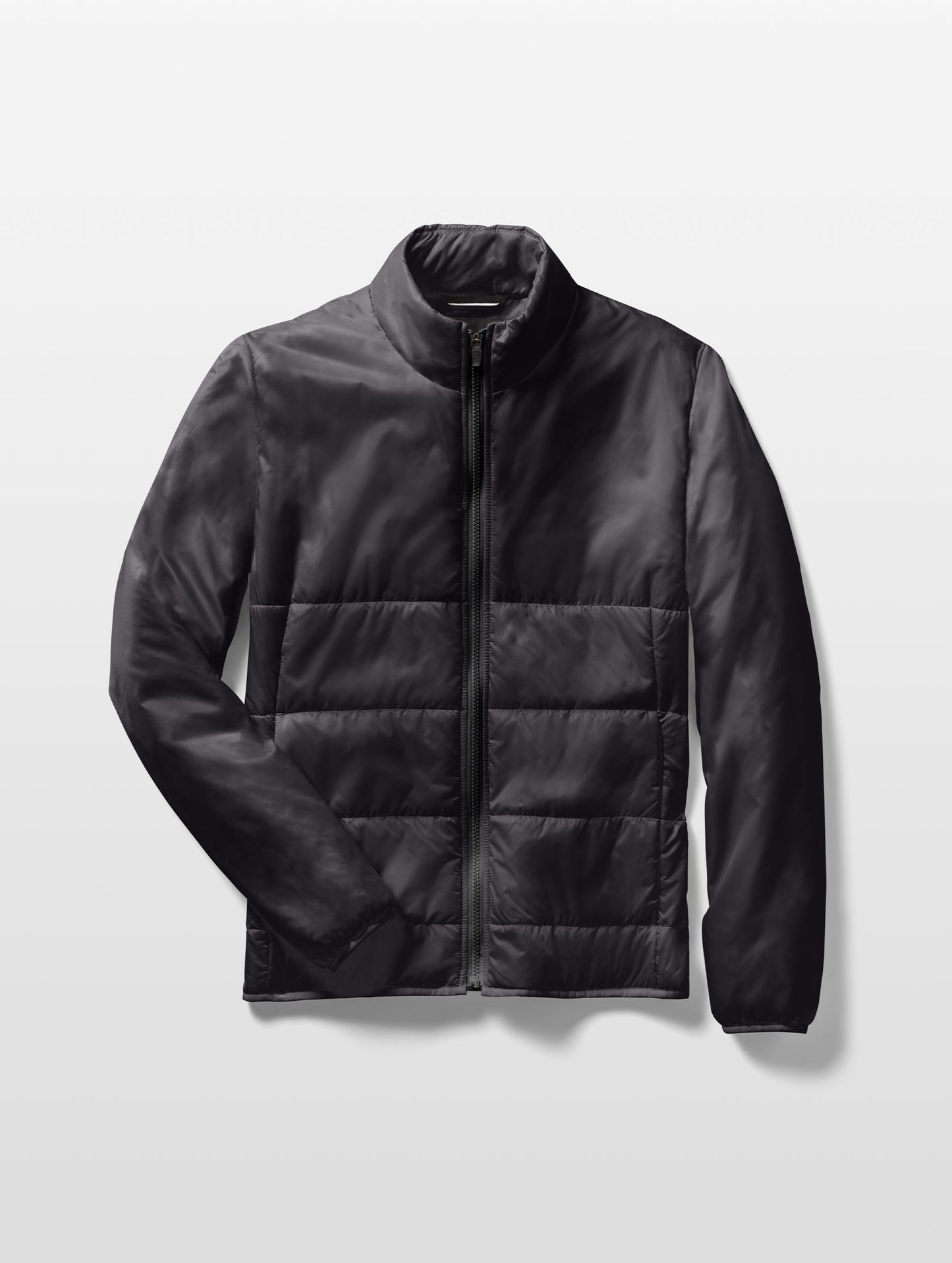 Flat lay of Eco Insulated Jacket in Onyx Black from AETHER Apparel.
