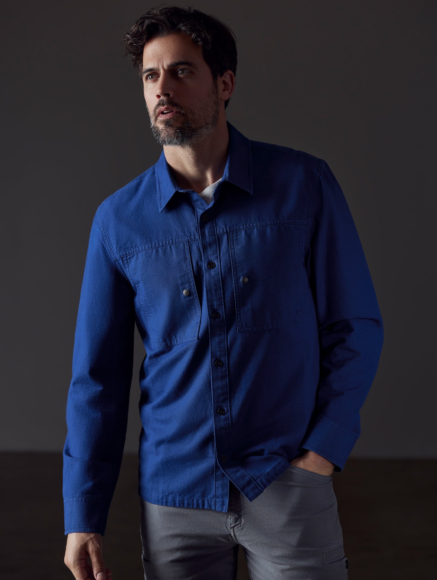 Front body view of man wearing Emerson Button Down in Dark Blue from AETHER Apparel.