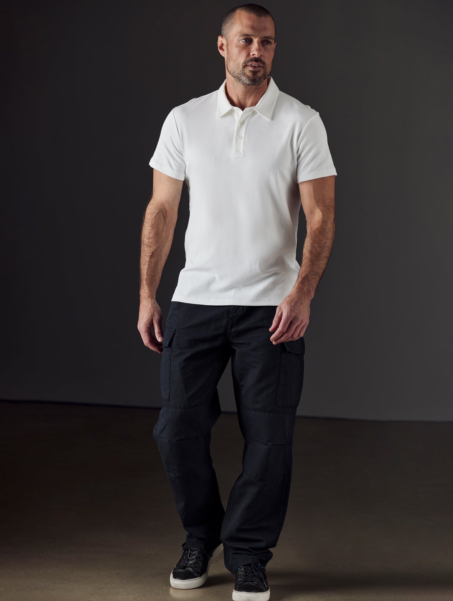 Front full-body view of man wearing Glade Fatigue Pant in Onyx Black from AETHER Apparel.
