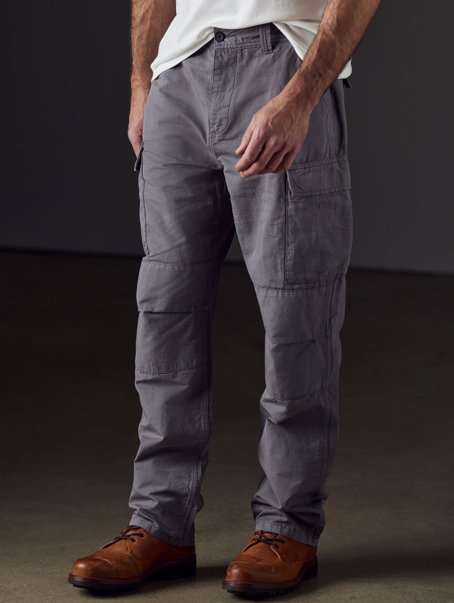 Front 3/4 lower body view of man wearing Glade Fatigue Pant in Storm grey from AETHER Apparel.
