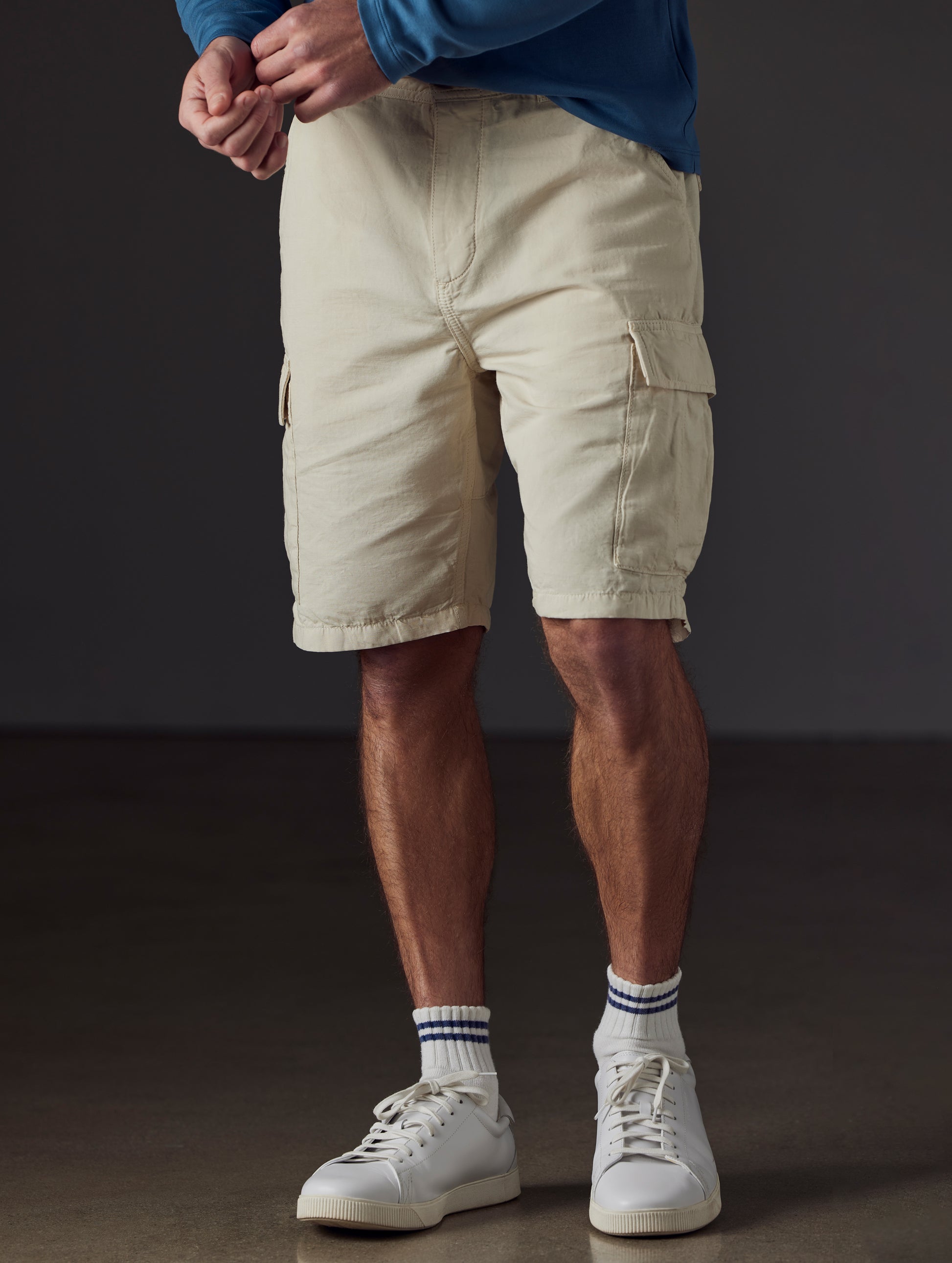 Front lower body view of man wearing Glade Fatigue Short in Bone white from AETHER Apparel.