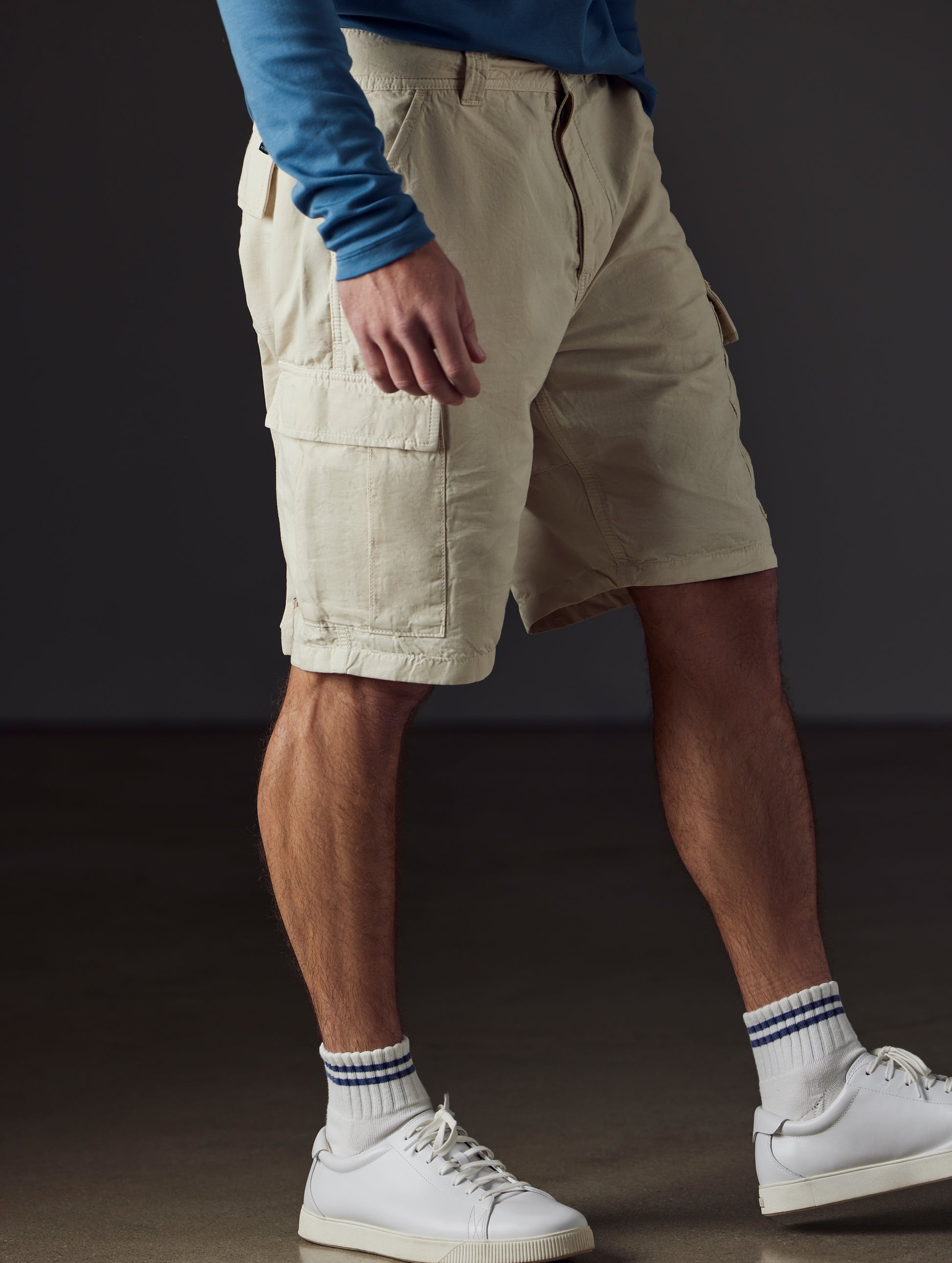 Front 3/4 lower body view of man wearing Glade Fatigue Short in Bone white from AETHER Apparel.