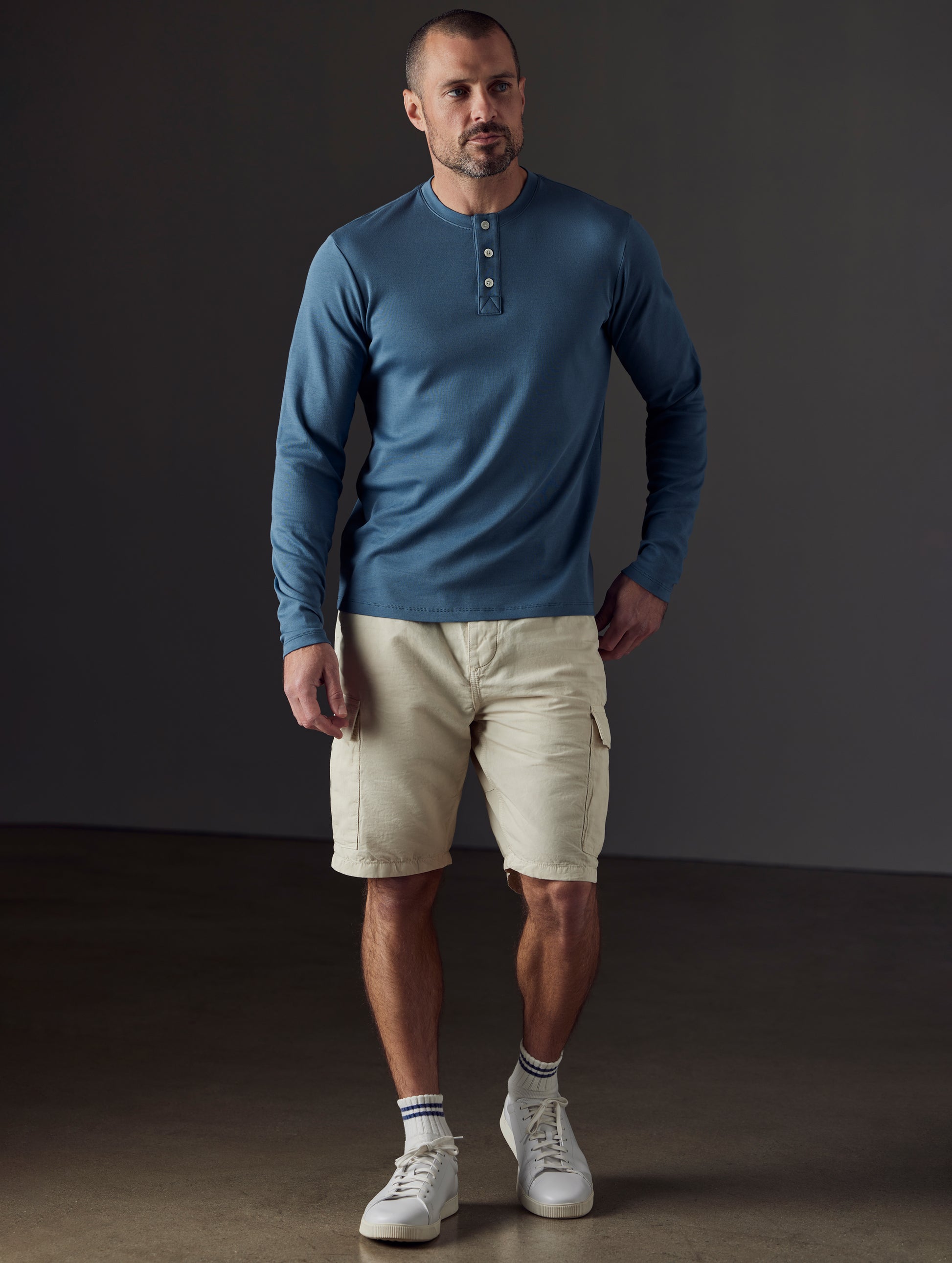 Front full-body view of man wearing Glade Fatigue Short in Bone white from AETHER Apparel.
