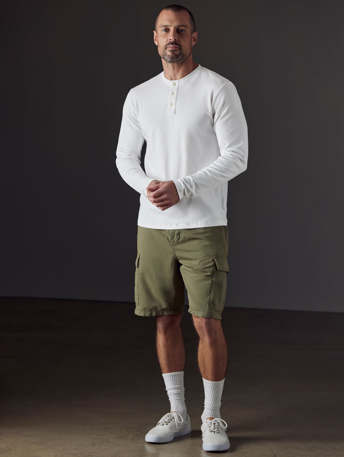Front full-body view of man wearing Glade Fatigue Short in Fern Green from AETHER Apparel.